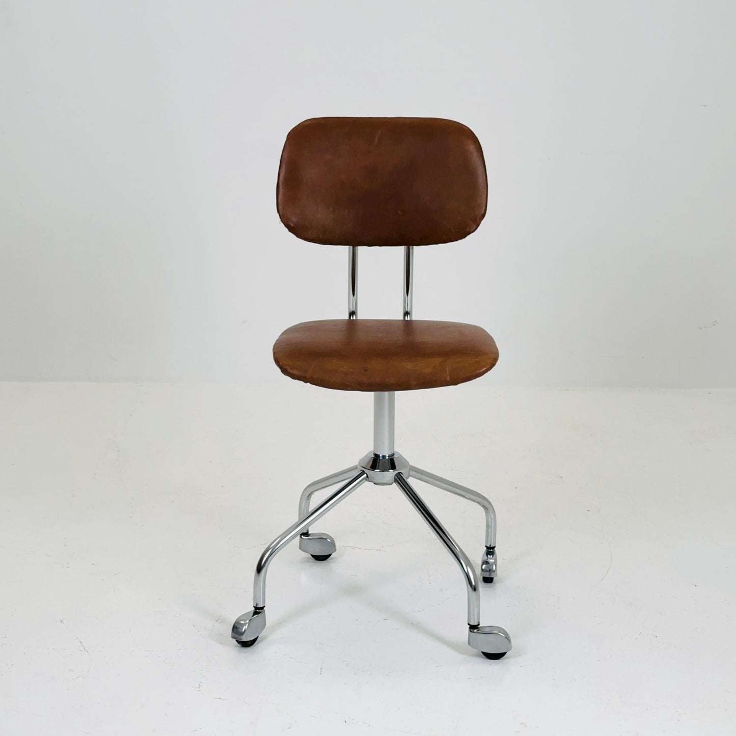 Vintage office/desk chair in brown leather with swivel steel structure Italy 1960s