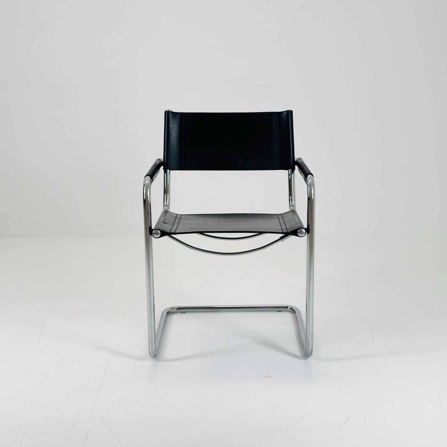 1 of 2 vintage B34 dark black color leather cantilevered chairs by Mart Stam for Jox Interni Italy 1980s