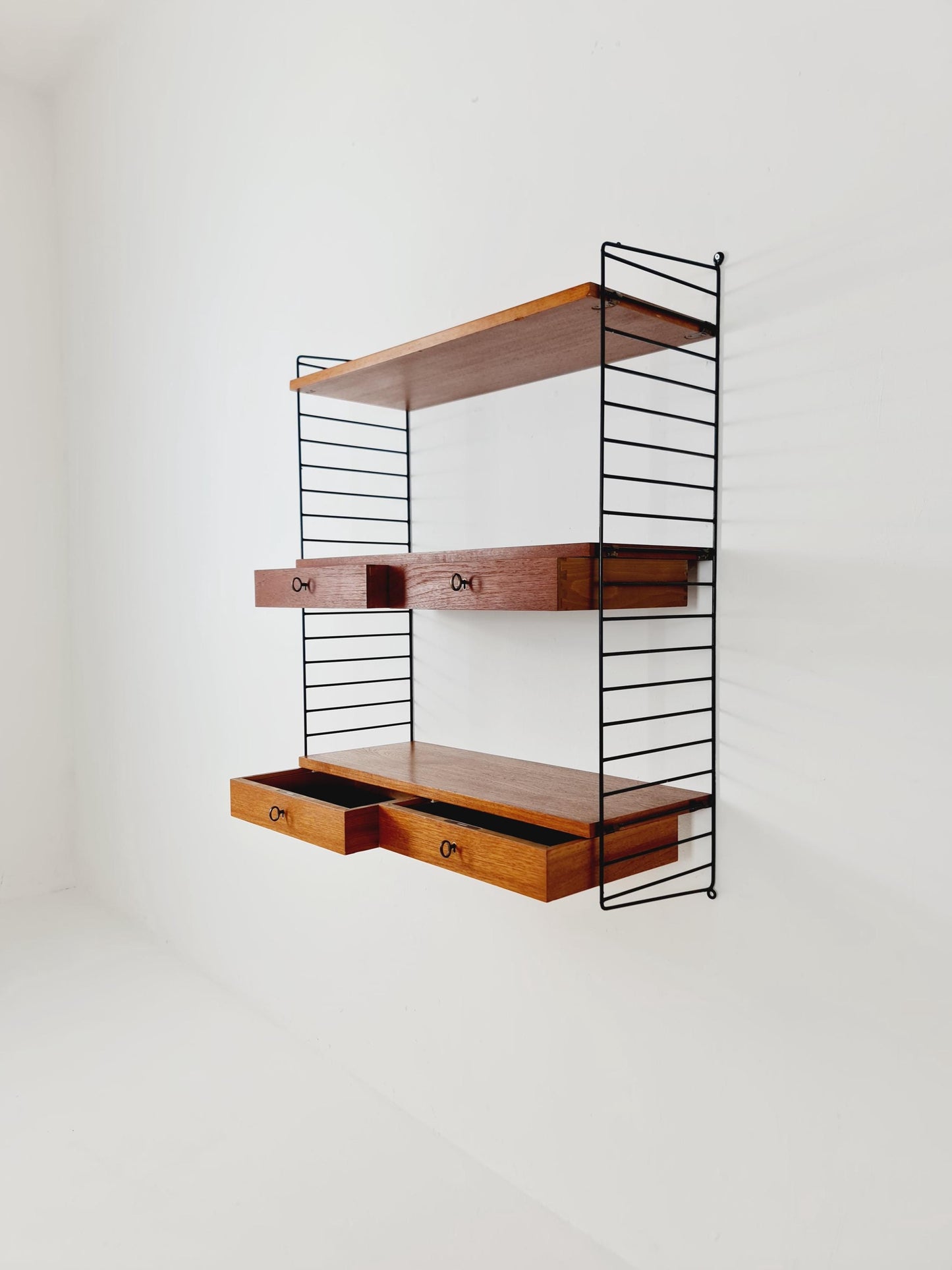 Original MCM Teak shelving system - consists of black lacquered metal ladders, from string Stockholm 1960s