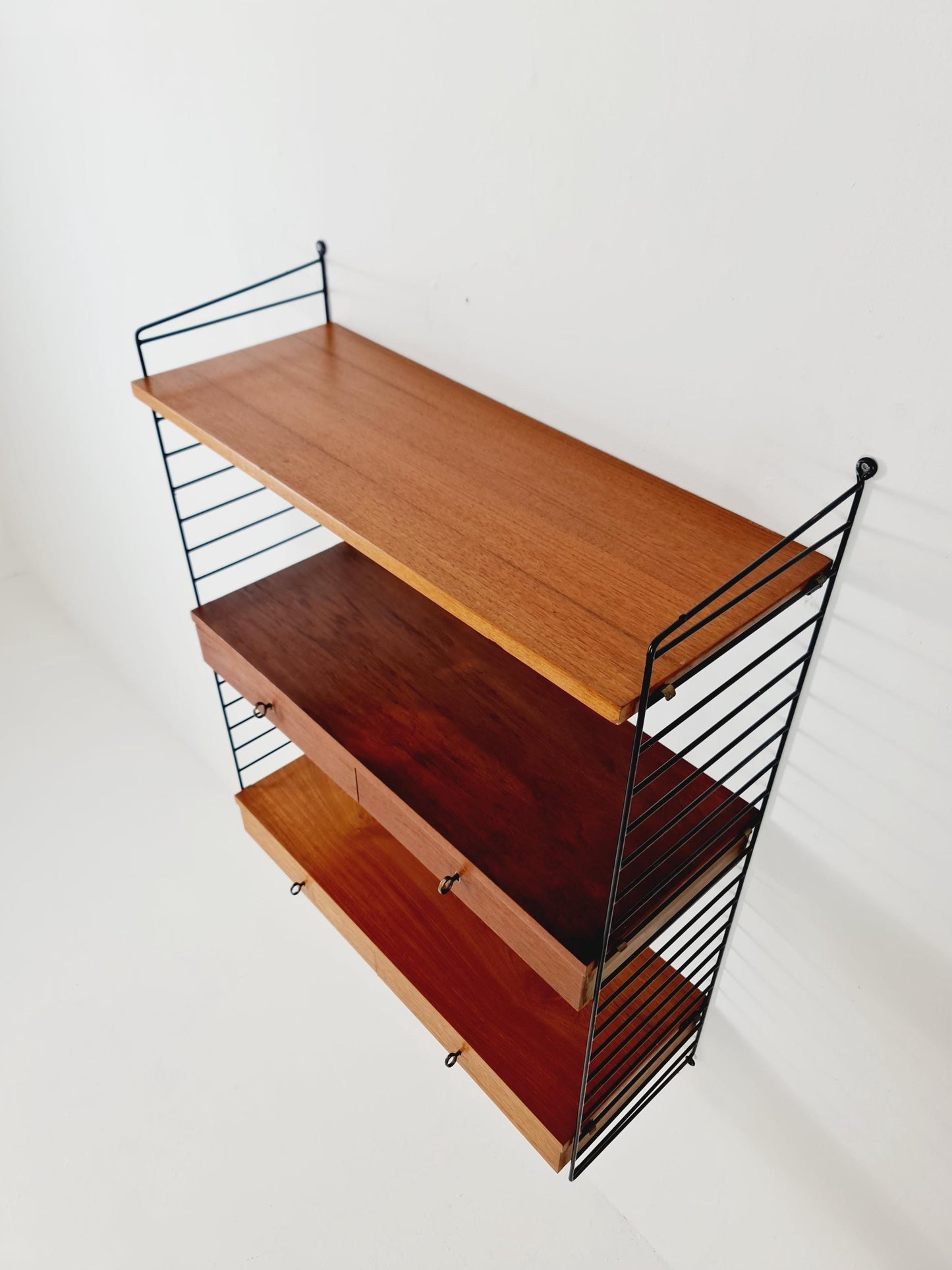 Original MCM Teak shelving system - consists of black lacquered metal ladders, from string Stockholm 1960s