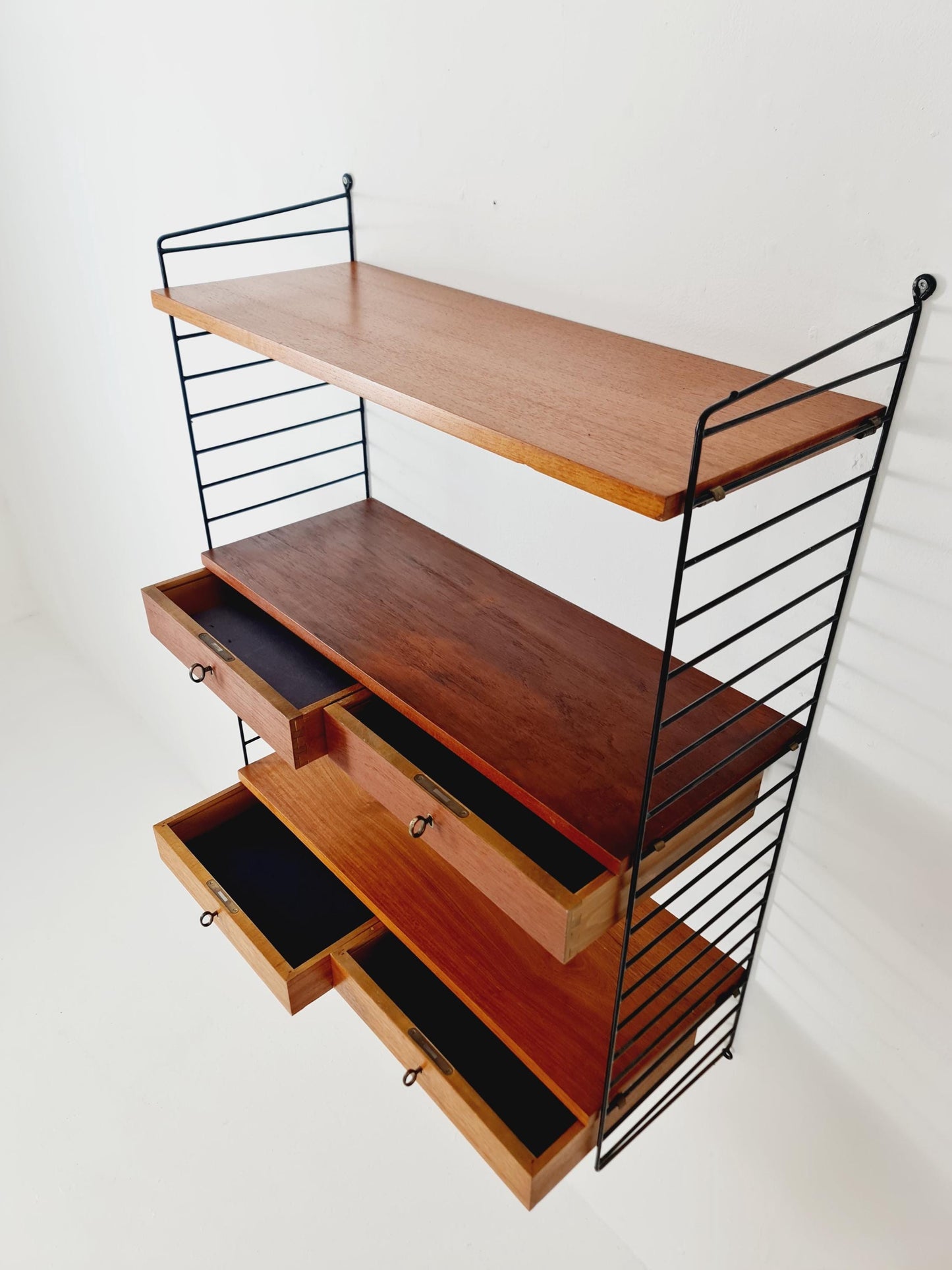 Original MCM Teak shelving system - consists of black lacquered metal ladders, from string Stockholm 1960s