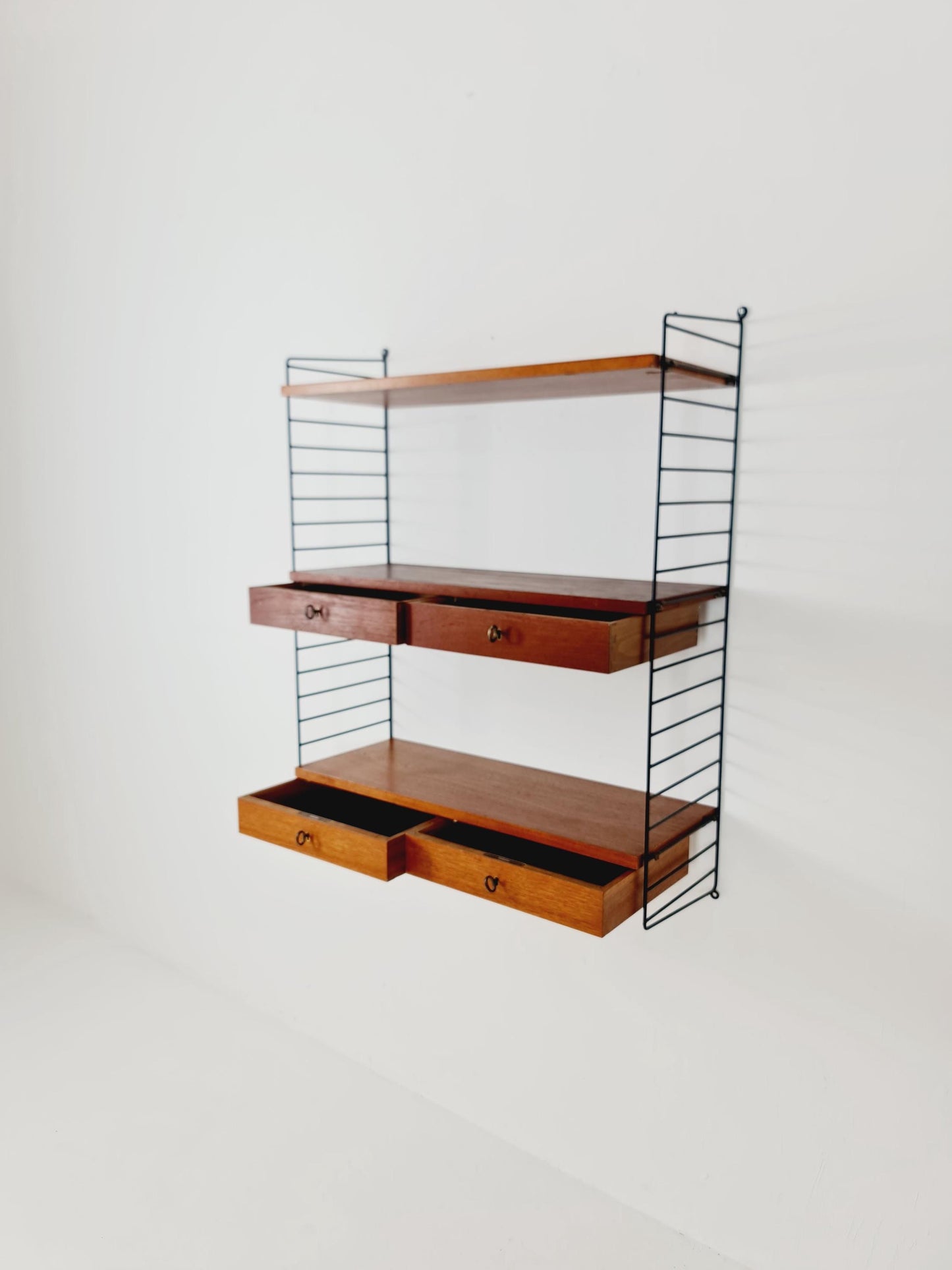 Original MCM Teak shelving system - consists of black lacquered metal ladders, from string Stockholm 1960s