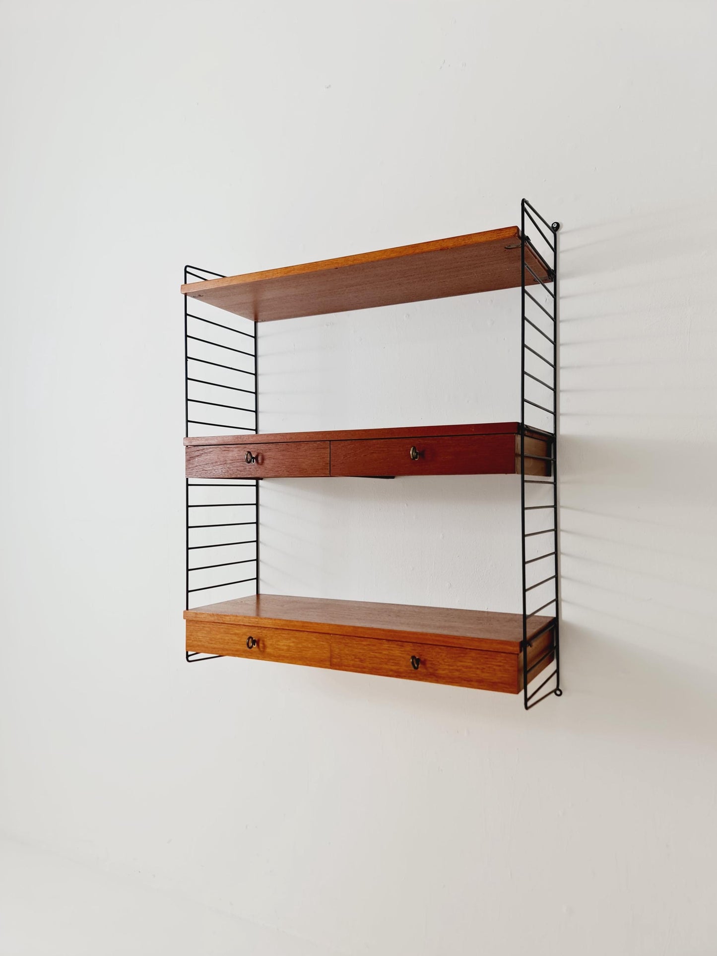 Original MCM Teak shelving system - consists of black lacquered metal ladders, from string Stockholm 1960s