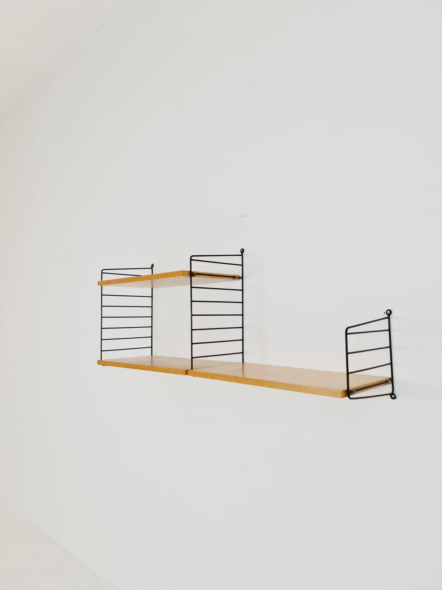 Original MCM Ash shelving system - consists of Black lacquered metal ladders, from string Stockholm 1960s