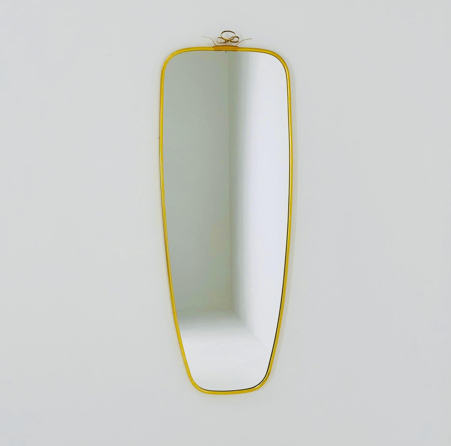 Mid Century asymmetric German brass Original kidney wall mirror from the 60s