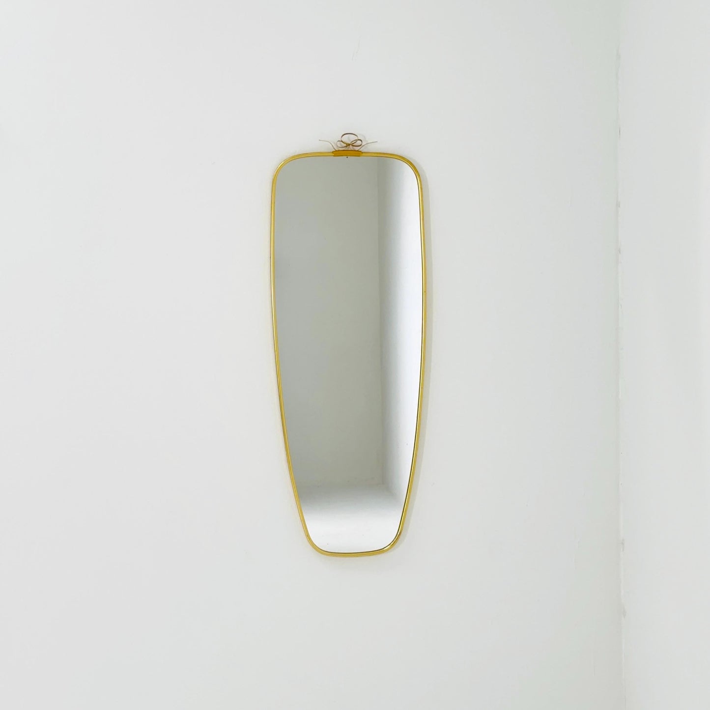 Mid Century asymmetric German brass Original kidney wall mirror from the 60s