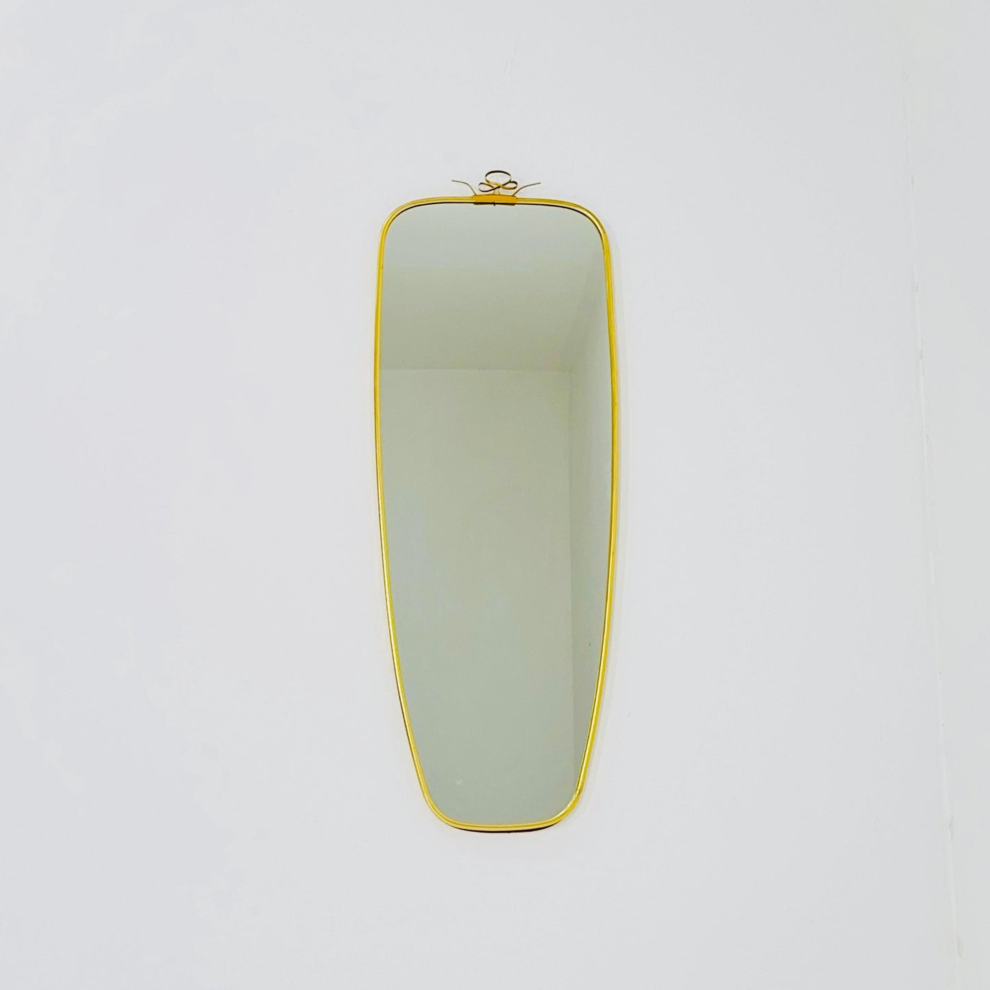 Mid Century asymmetric German brass Original kidney wall mirror from the 60s