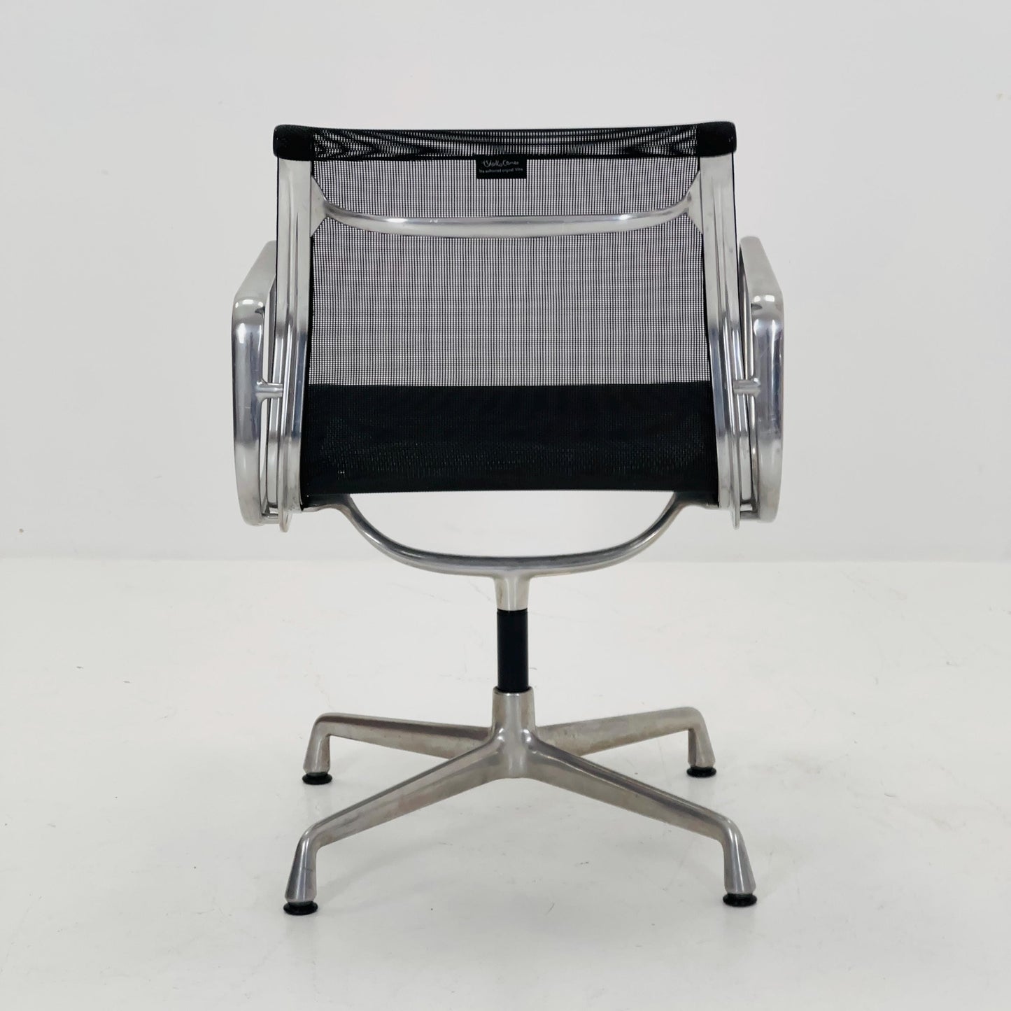 Mid century Eames EA 108 office chair by Vitra with black mesh and polished aluminum 1960s