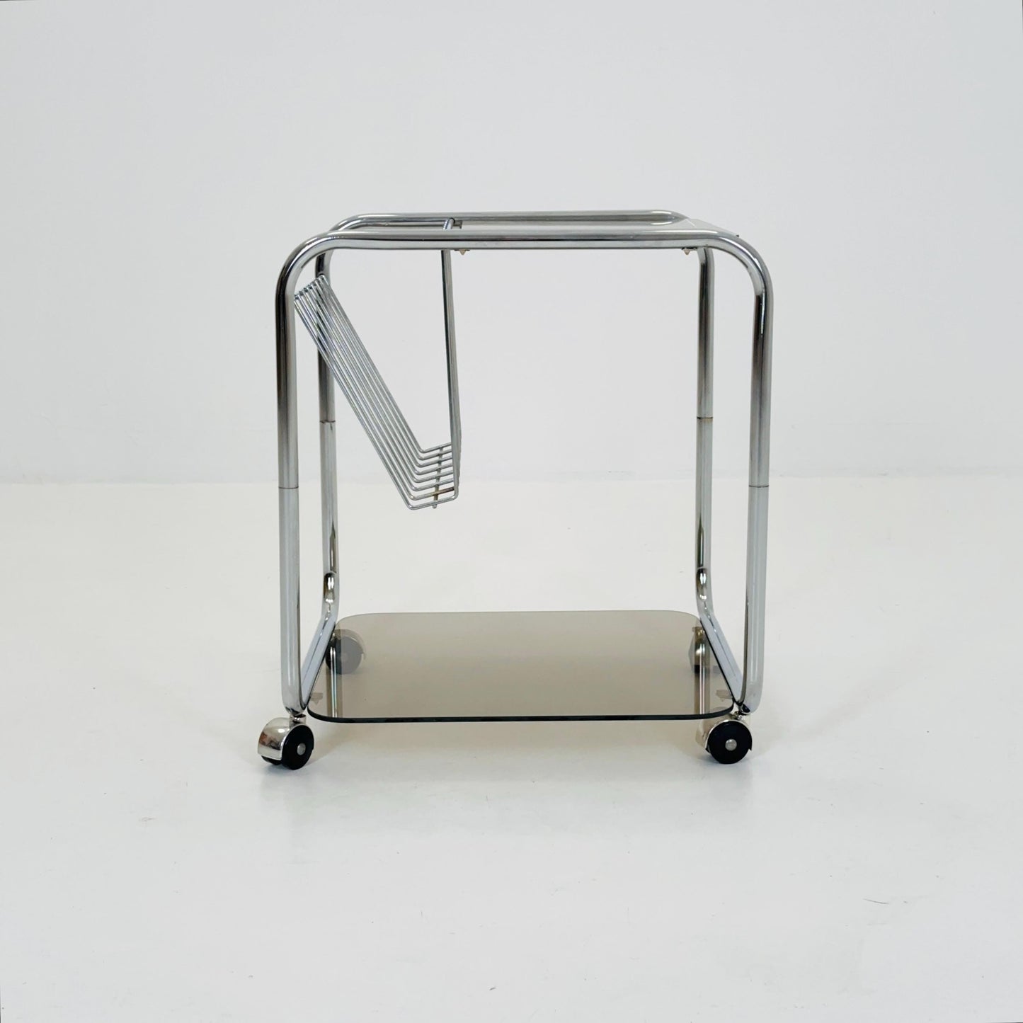 Mid century Chrome bar cart/serving trolley. magazine rack Smoked glass ,Bauhaus Germany 1980s