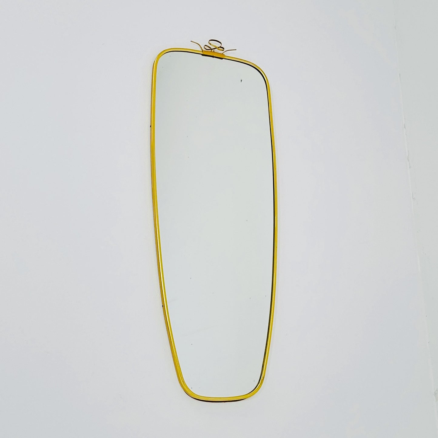Mid Century asymmetric German brass Original kidney wall mirror from the 60s