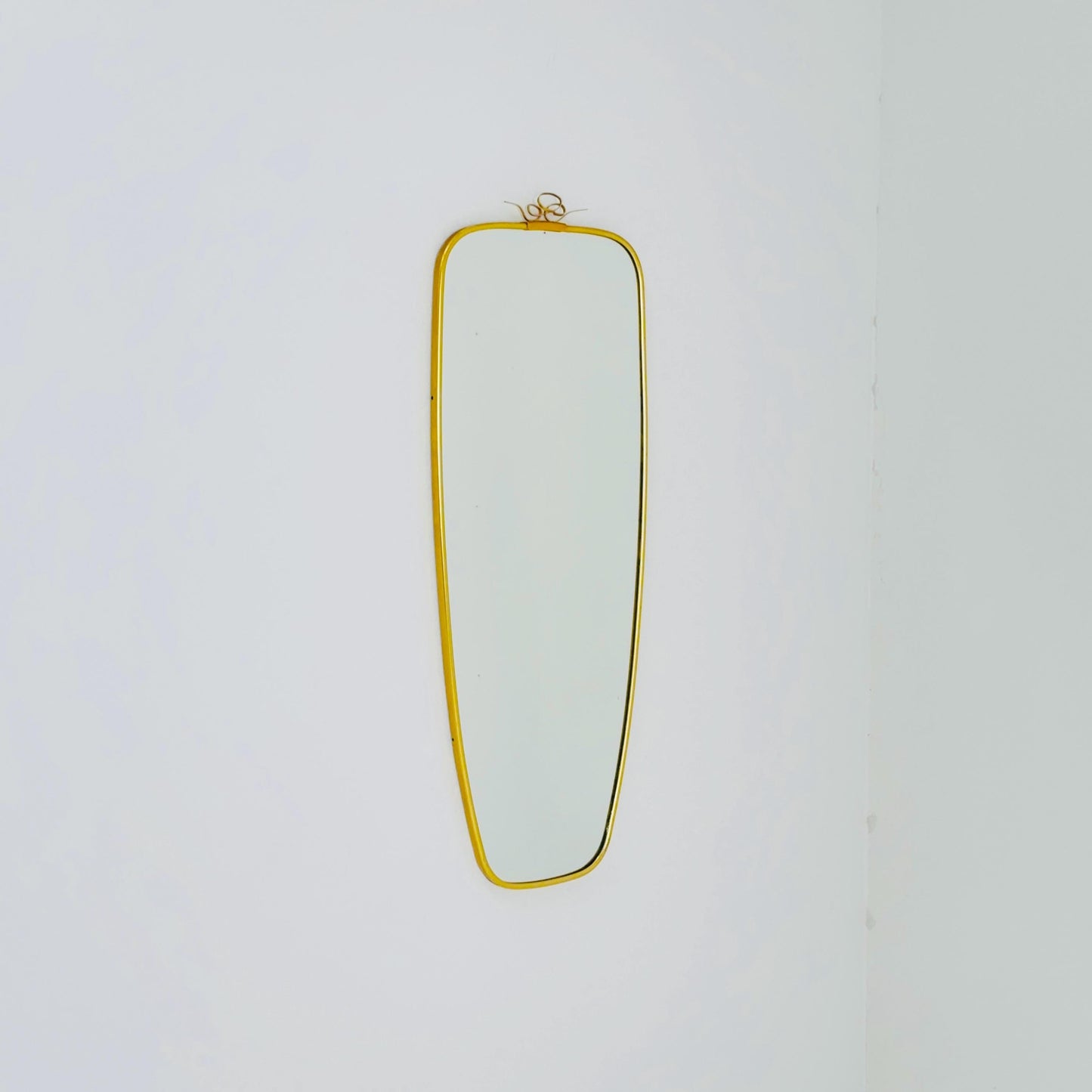 Mid Century asymmetric German brass Original kidney wall mirror from the 60s