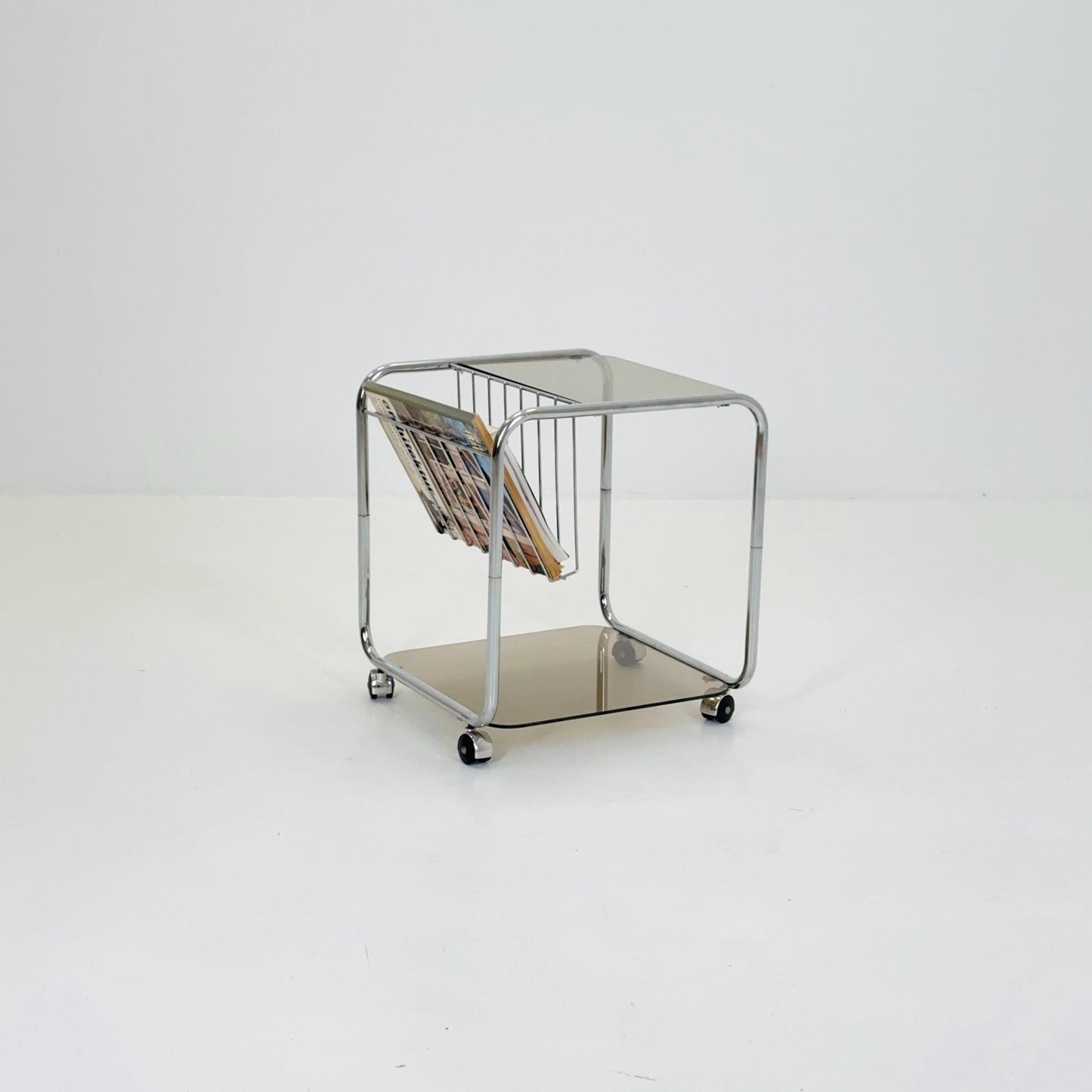 Mid century Chrome bar cart/serving trolley. magazine rack Smoked glass ,Bauhaus Germany 1980s