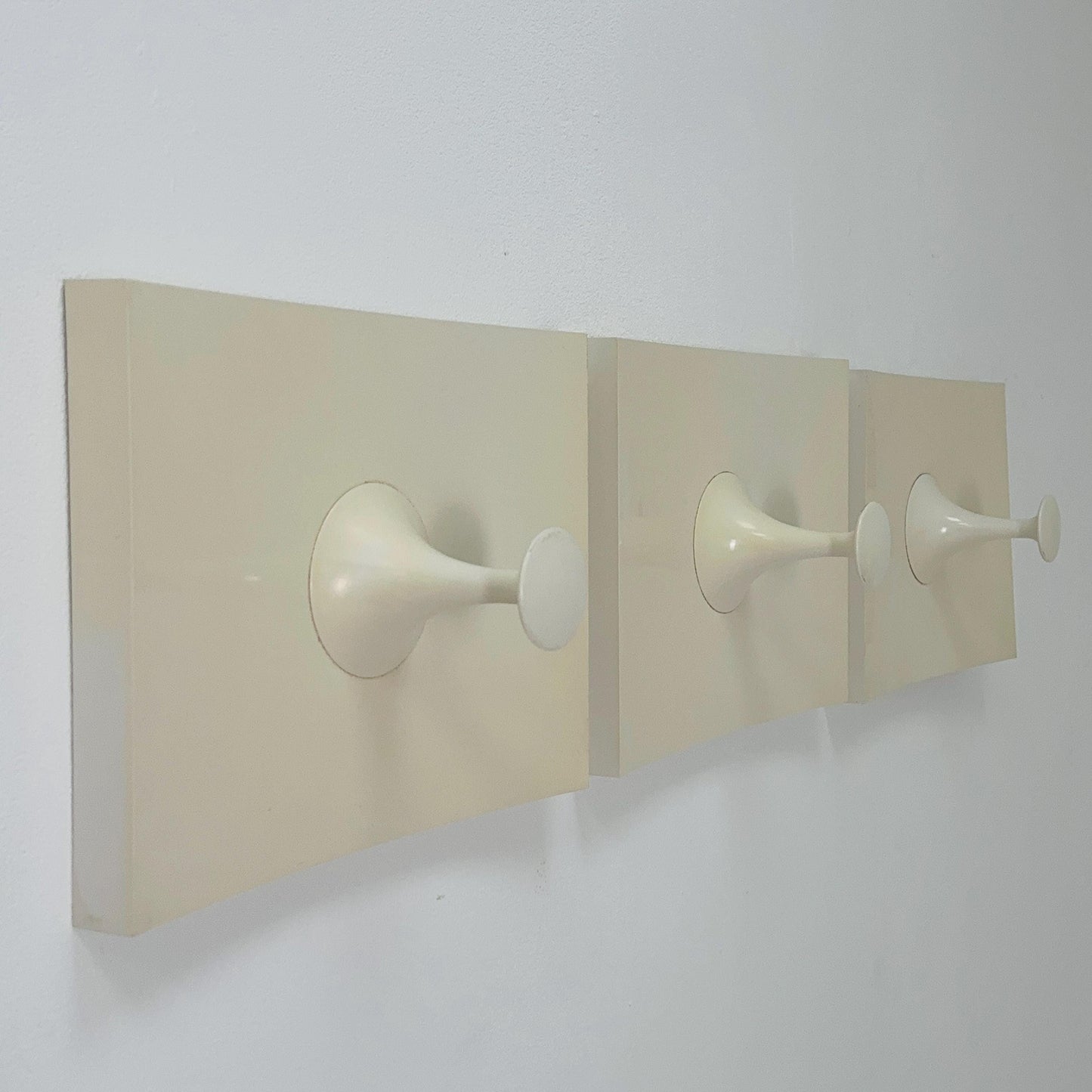 Set of 3 large space age coat hooks in plastic and painted wood by Schonbuch. Germany 1970s