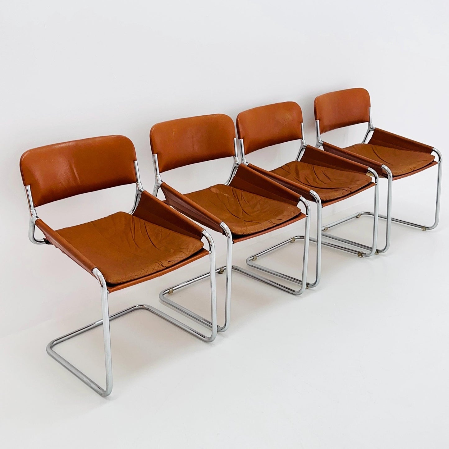 Set of 4 Mid century cognac leather & chrome tubular sling chair, Italy 1970