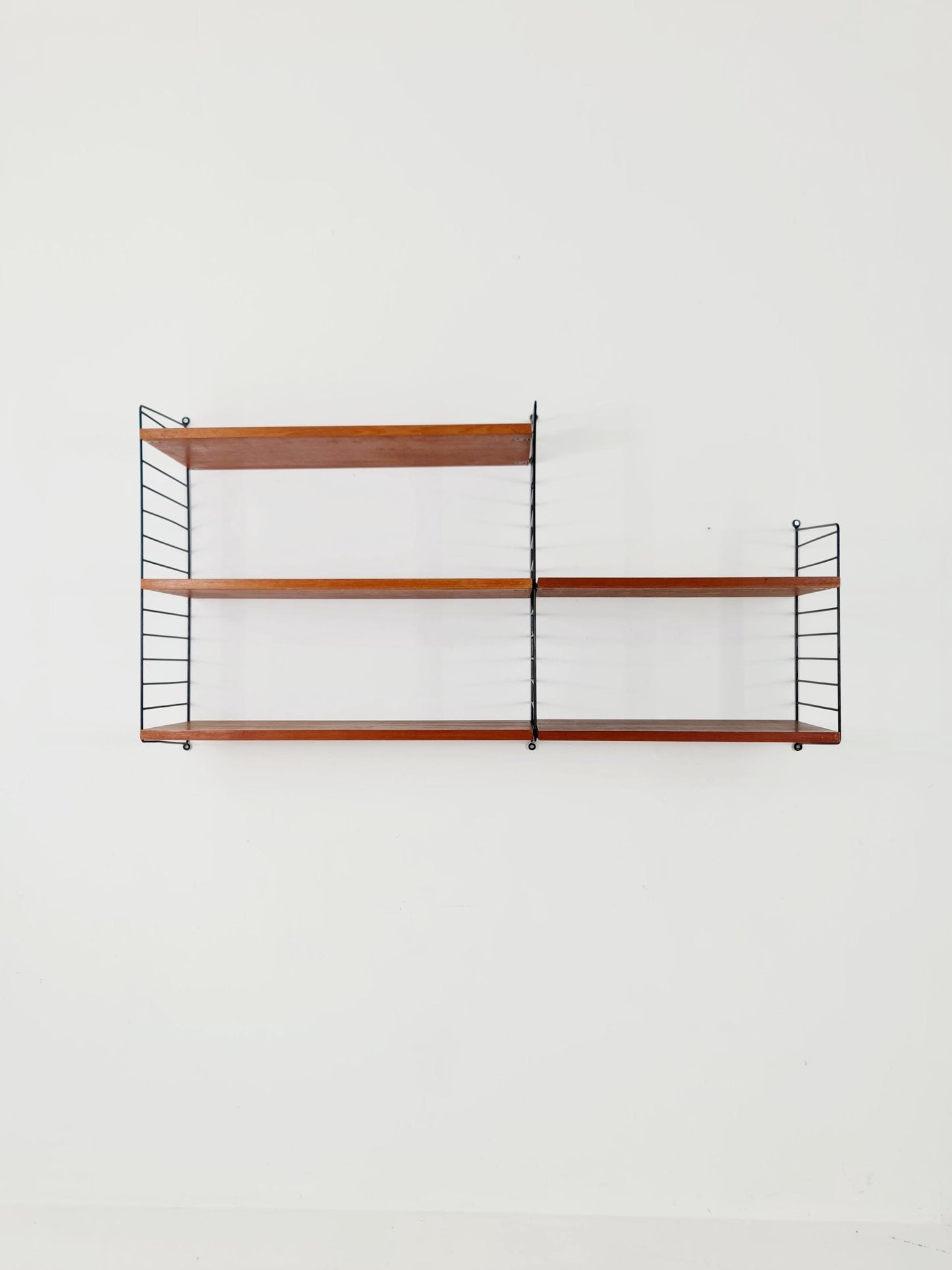 Original MCM Teak shelving system - consists of Black lacquered metal ladders, from string Stockholm 1960s