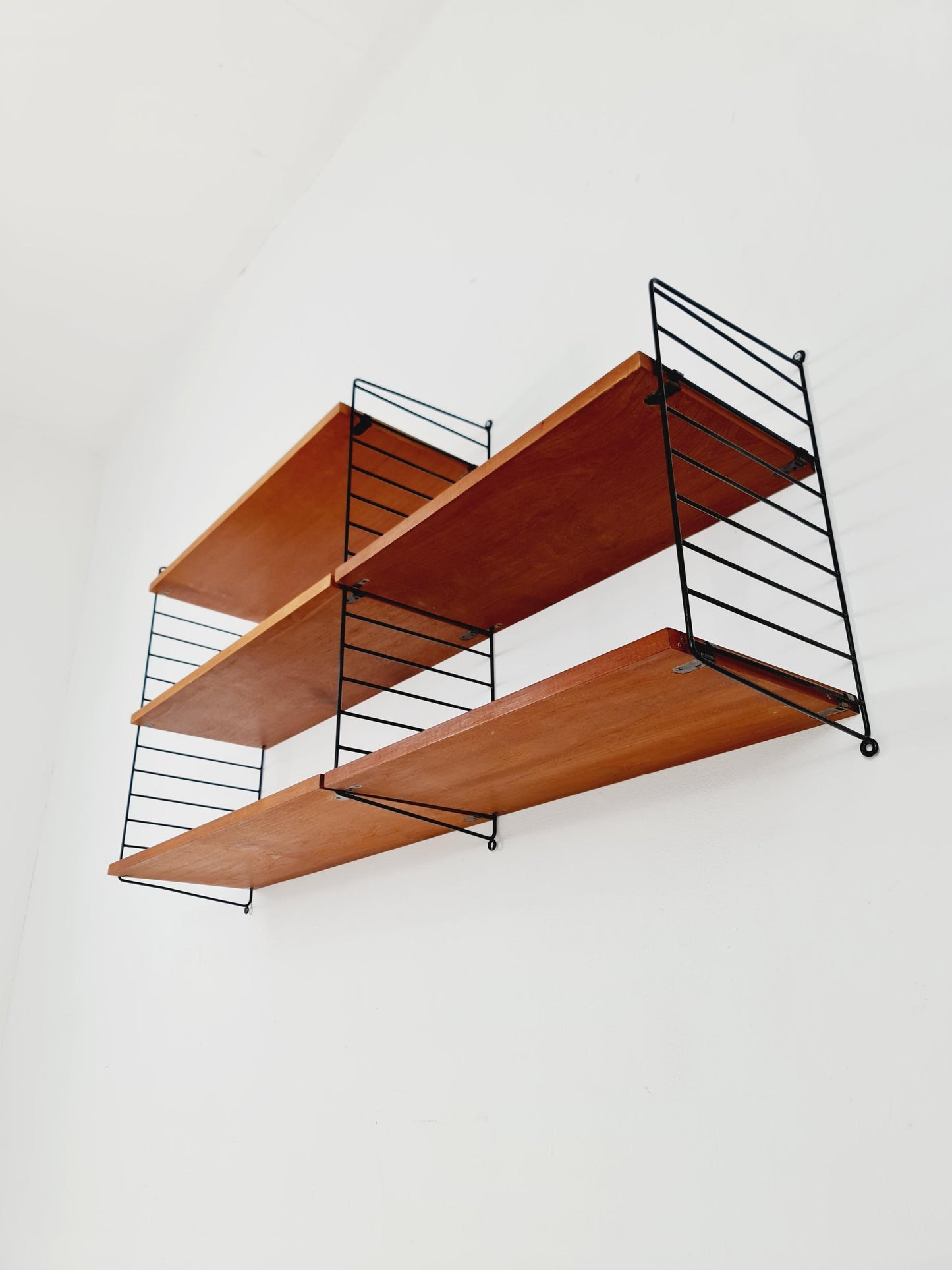 Original MCM Teak shelving system - consists of Black lacquered metal ladders, from string Stockholm 1960s