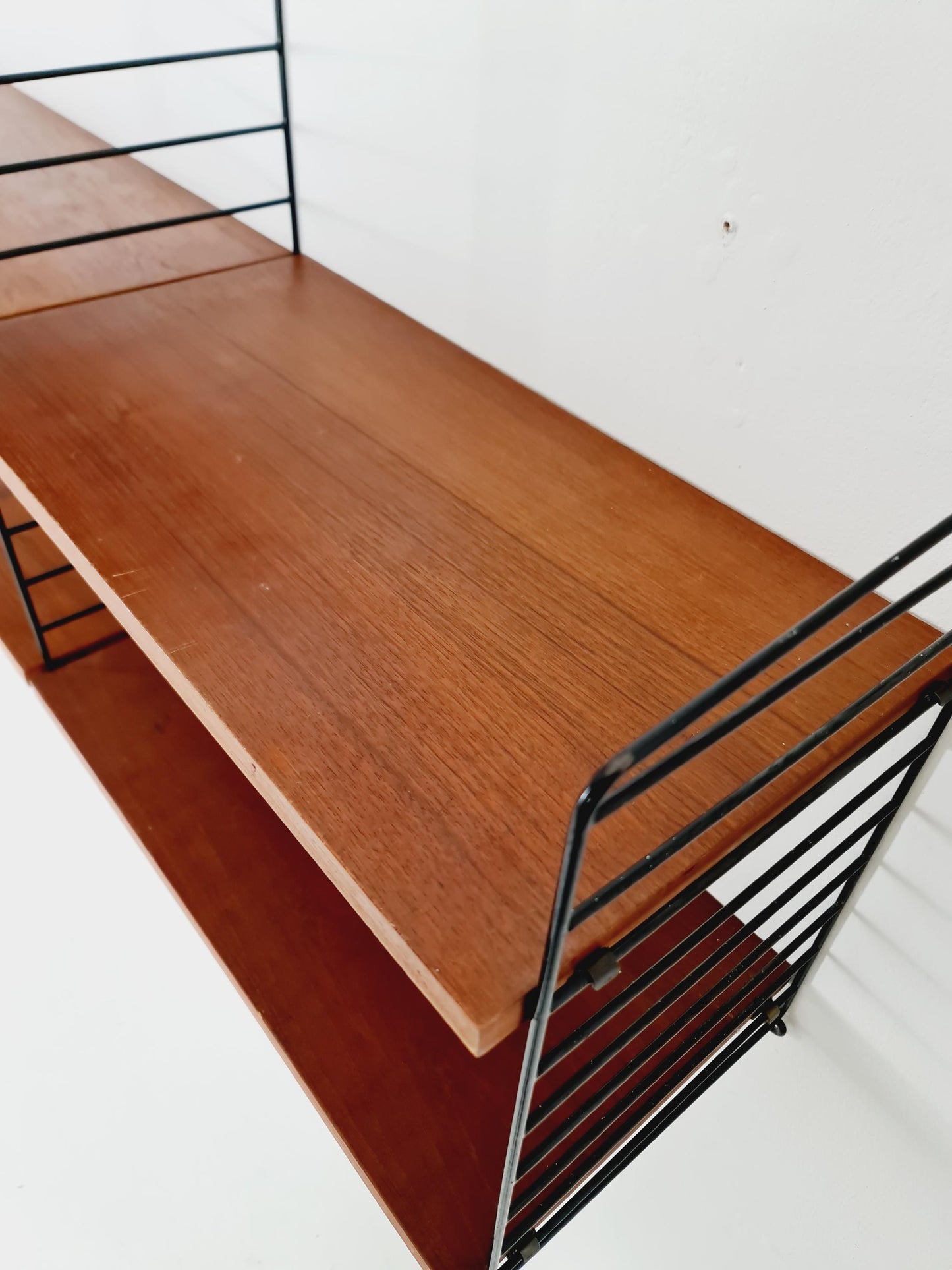Original MCM Teak shelving system - consists of Black lacquered metal ladders, from string Stockholm 1960s