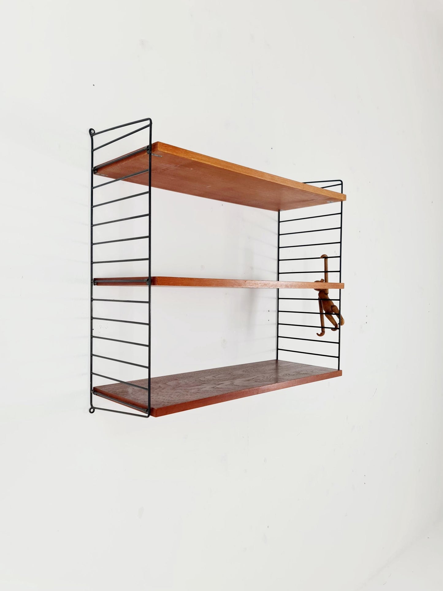 Original MCM Teak shelving system - consists of black lacquered metal ladders, from string Stockholm 1960s