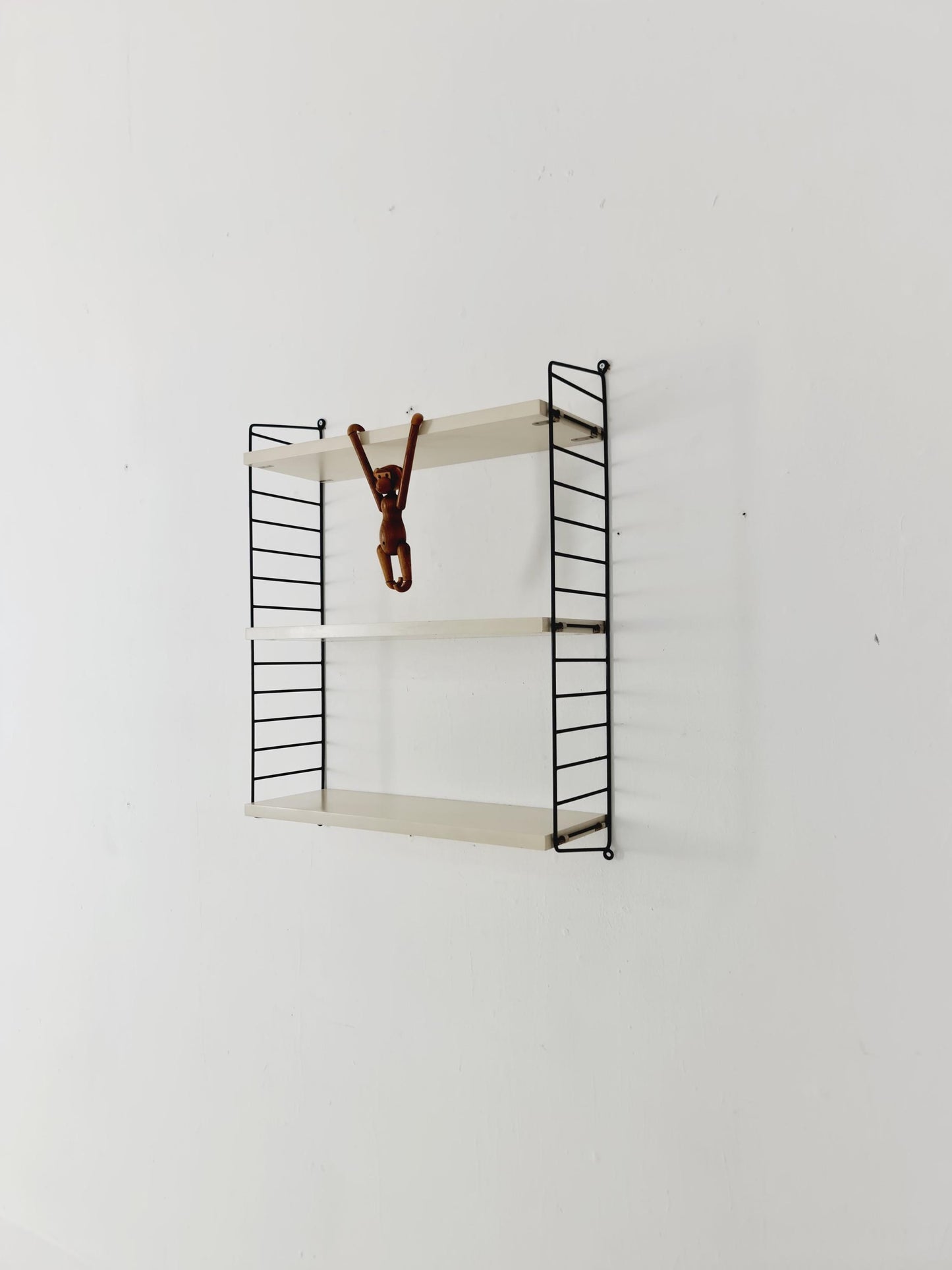 Original MCM wood shelving system - consists of black lacquered metal ladders, from string Stockholm 1960s