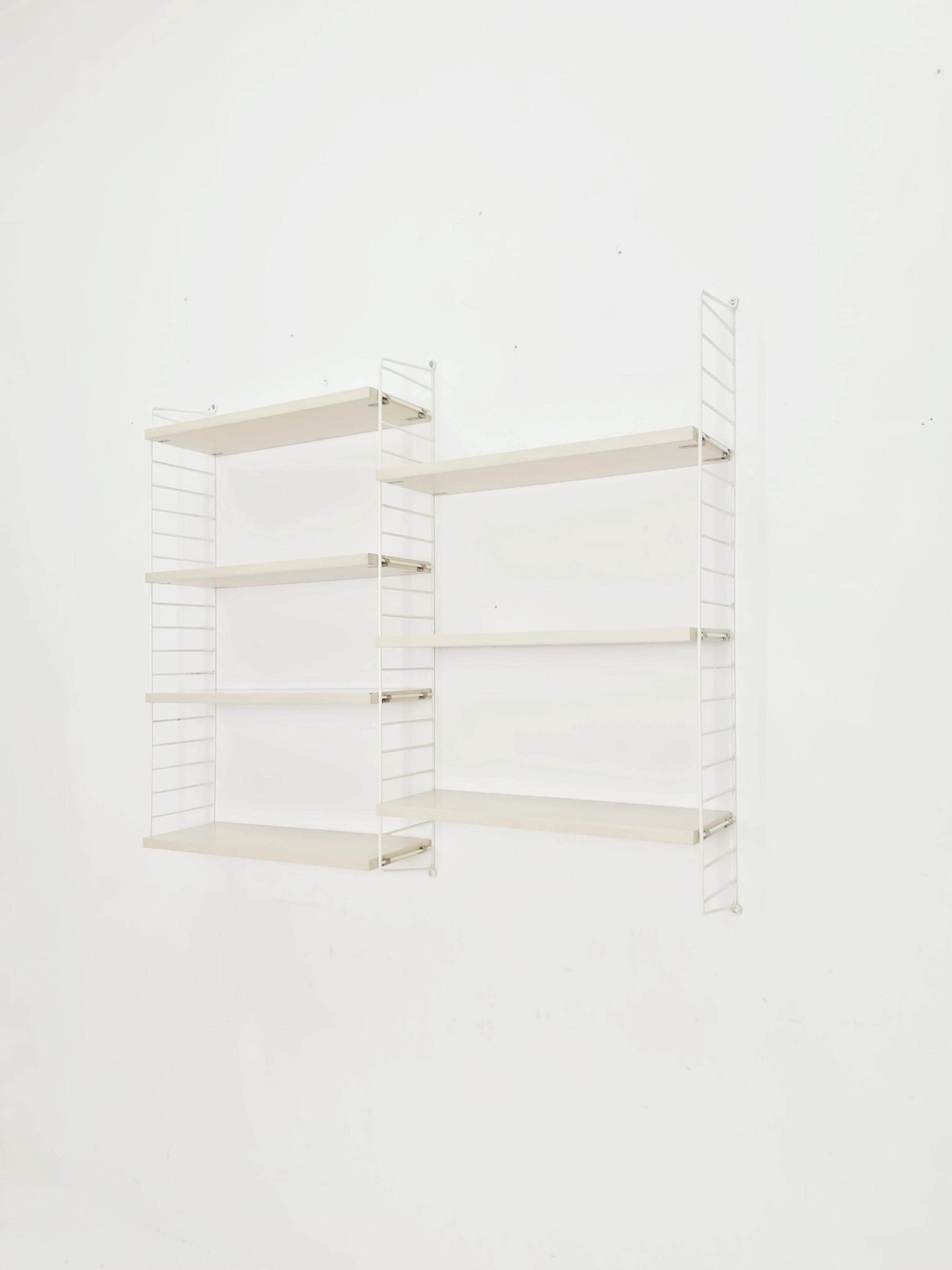 Original MCM wood shelving system - consists of black lacquered metal ladders, from string Stockholm 1960s