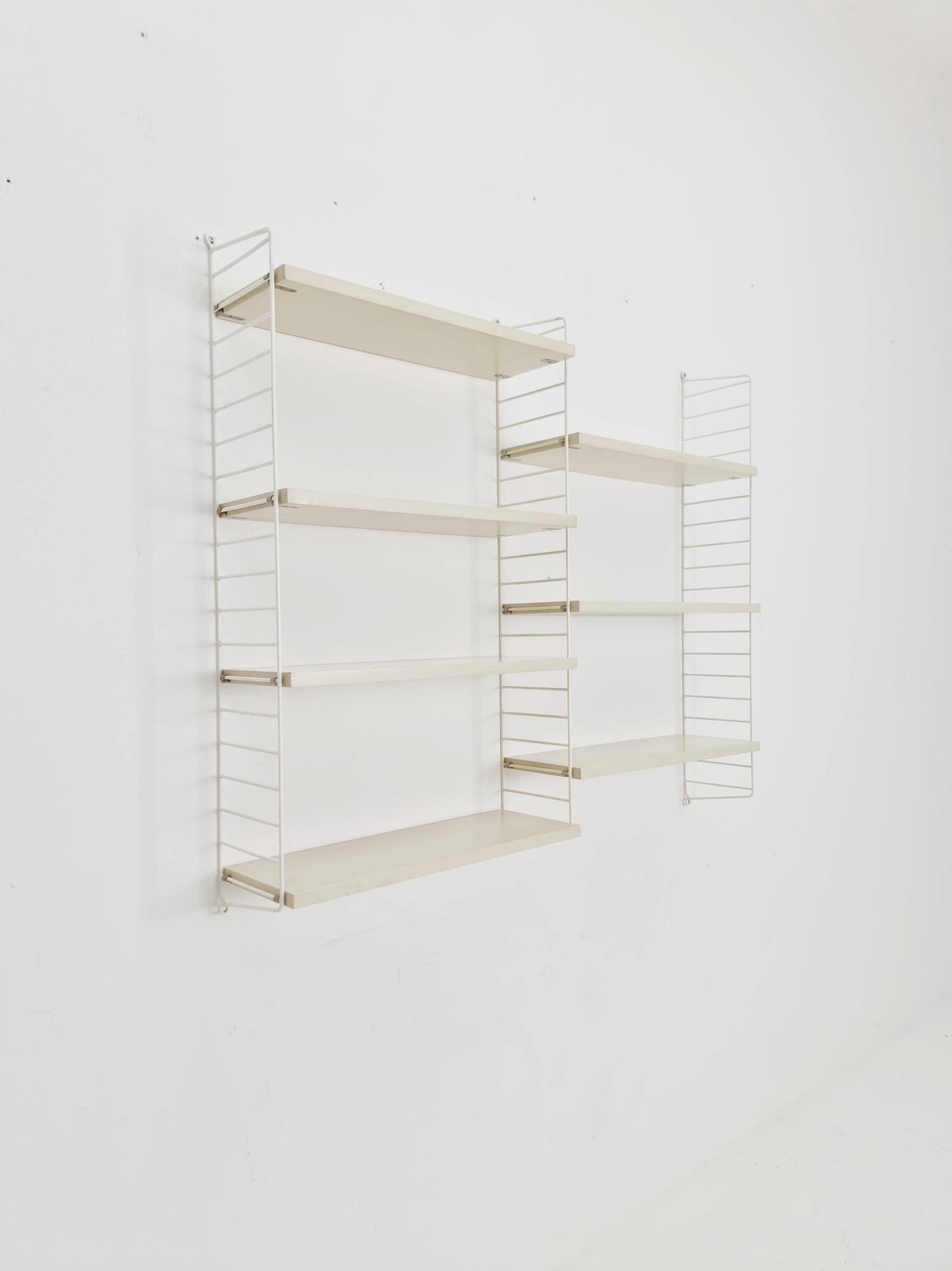 Original MCM wood shelving system - consists of black lacquered metal ladders, from string Stockholm 1960s