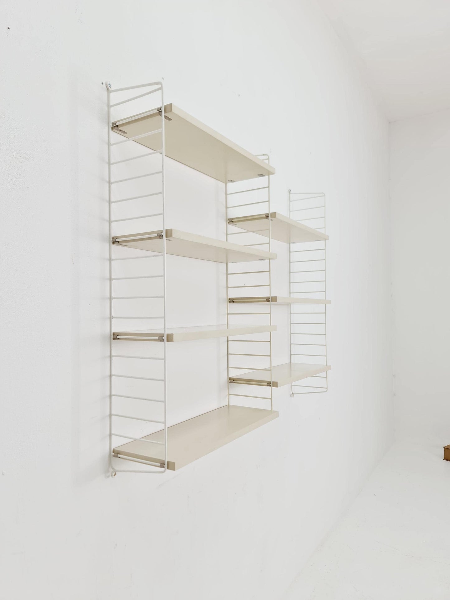 Original MCM wood shelving system - consists of black lacquered metal ladders, from string Stockholm 1960s