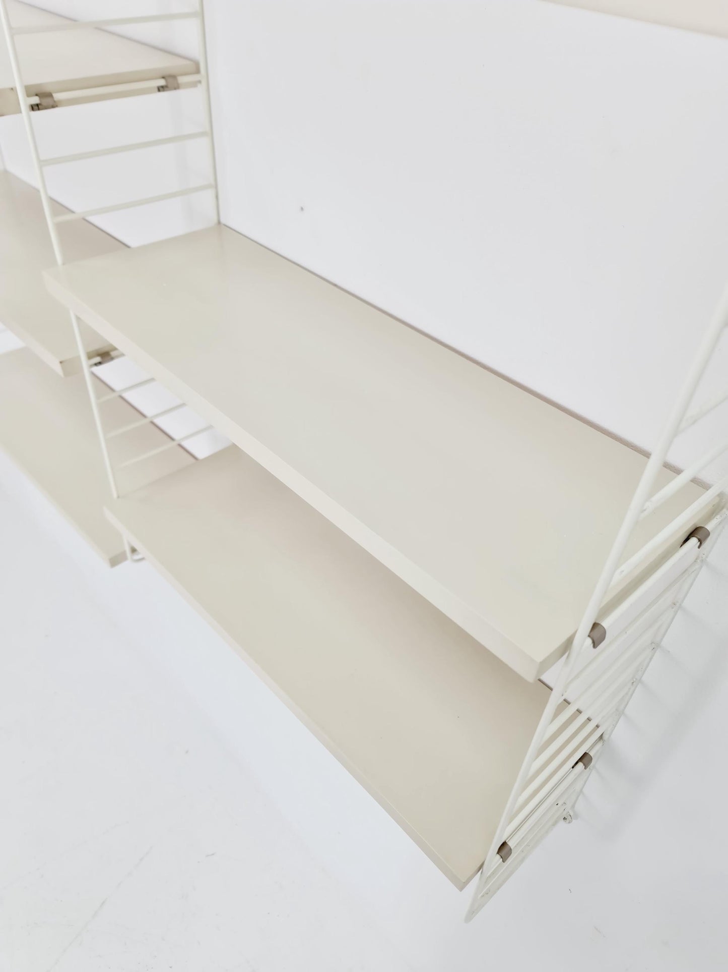 Original MCM wood shelving system - consists of black lacquered metal ladders, from string Stockholm 1960s
