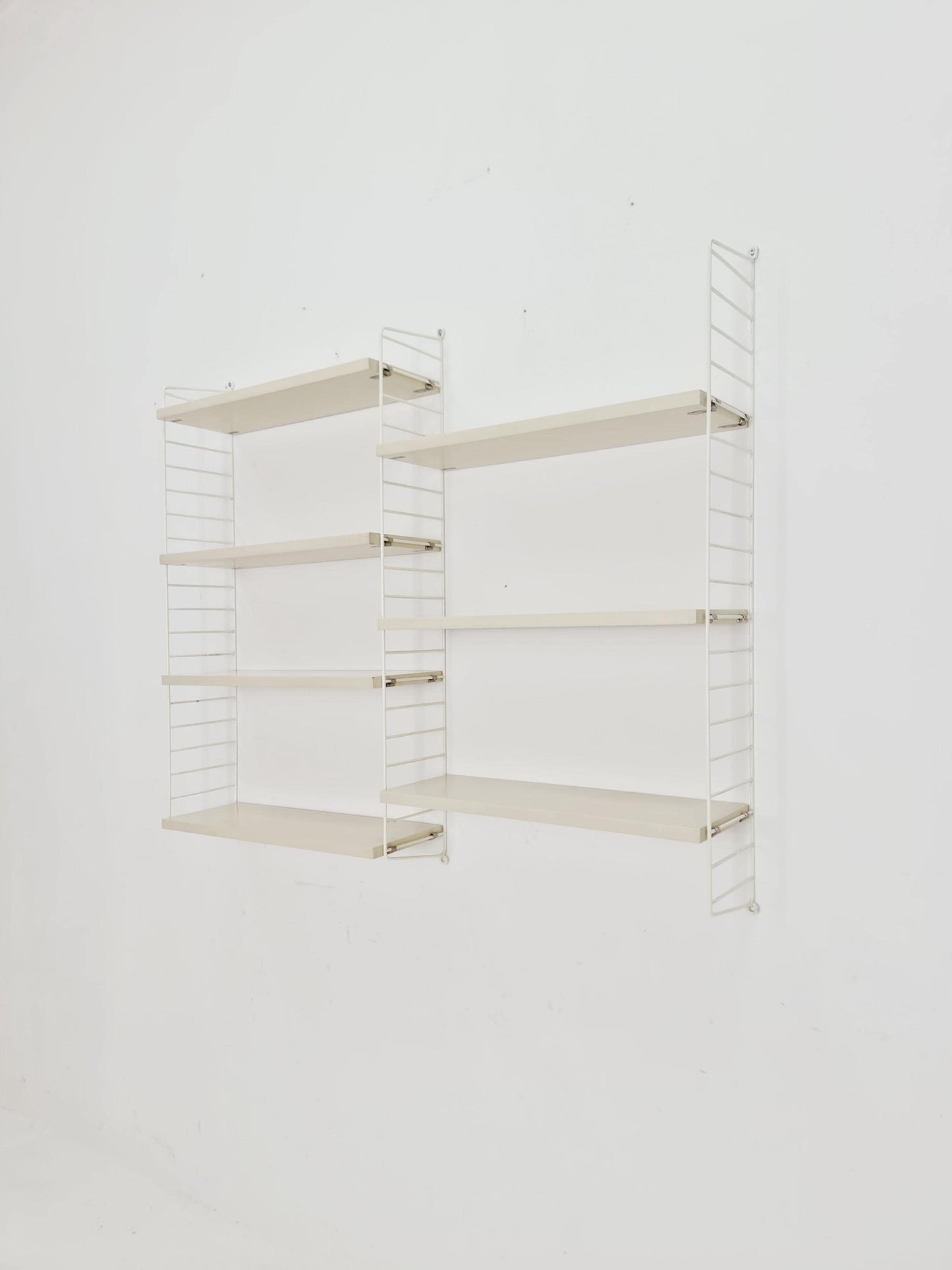 Original MCM wood shelving system - consists of black lacquered metal ladders, from string Stockholm 1960s