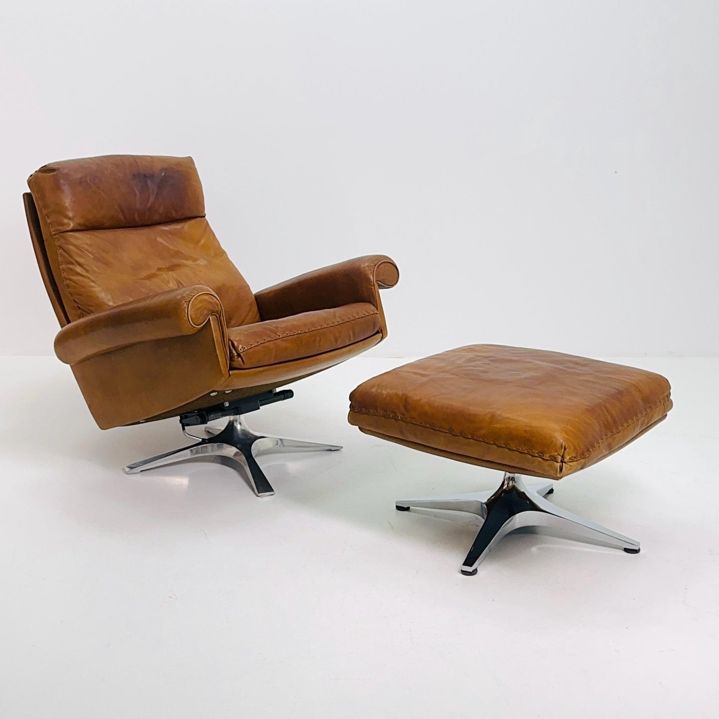 Mid Century De Sede DS31 high back armchair and Ottoman in cognac leather Switzerland 1970s