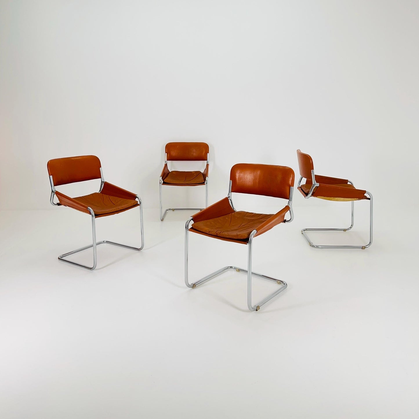 Set of 4 Mid century cognac leather & chrome tubular sling chair, Italy 1970