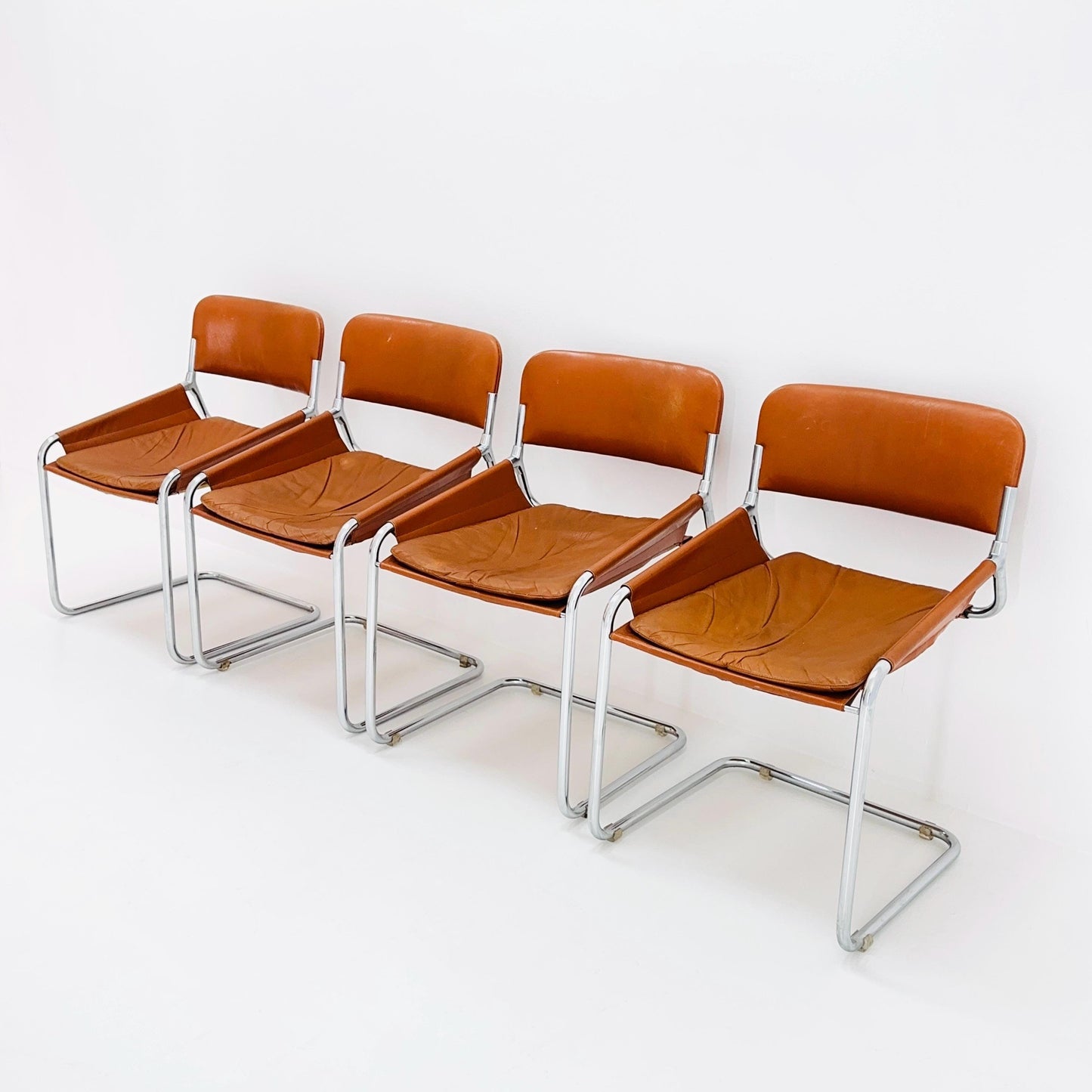Set of 4 Mid century cognac leather & chrome tubular sling chair, Italy 1970