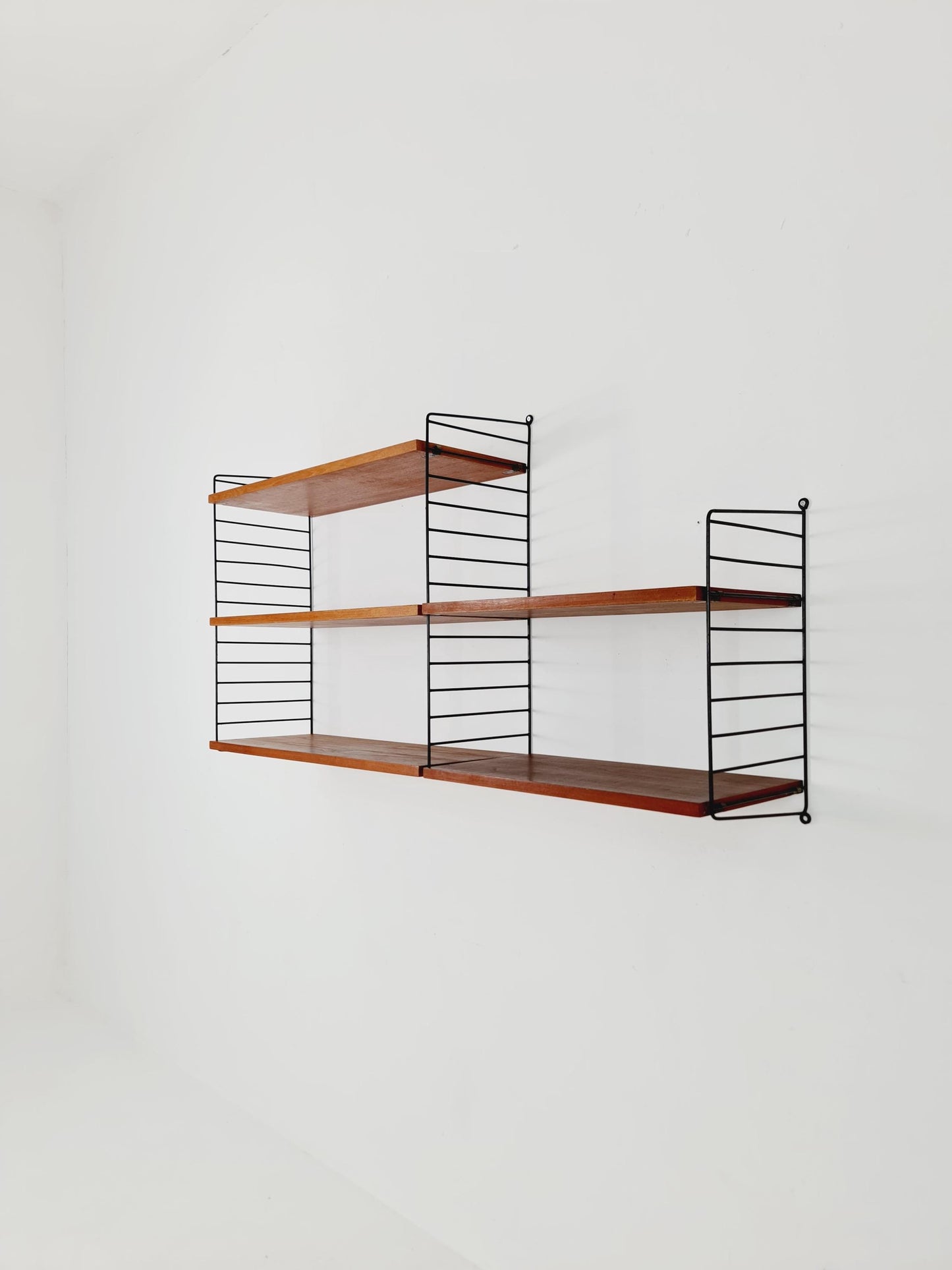 Original MCM Teak shelving system - consists of Black lacquered metal ladders, from string Stockholm 1960s