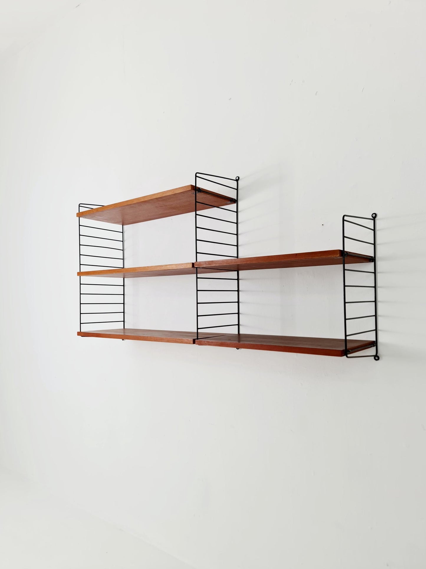 Original MCM Teak shelving system - consists of Black lacquered metal ladders, from string Stockholm 1960s
