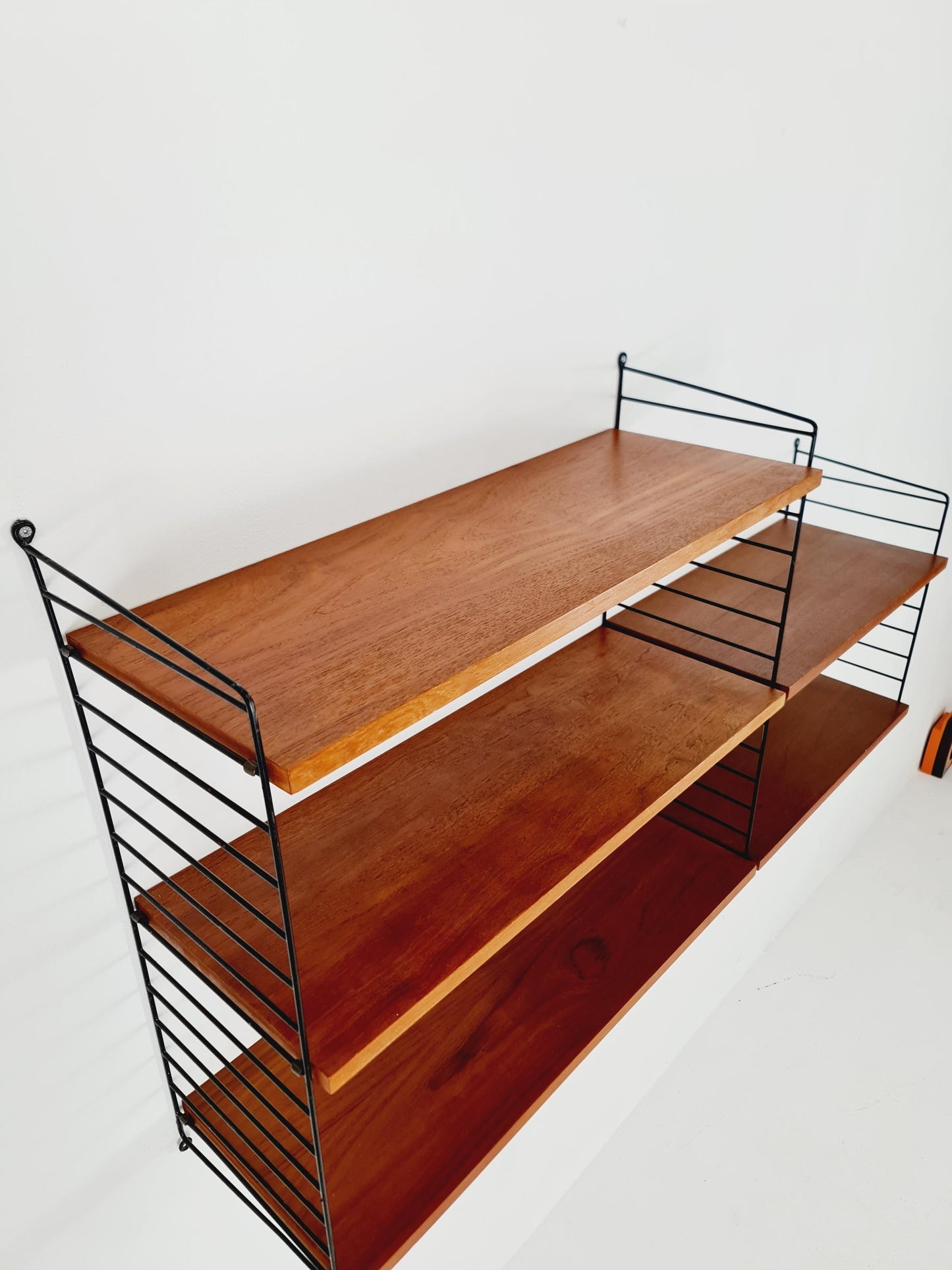 Original MCM Teak shelving system - consists of Black lacquered metal ladders, from string Stockholm 1960s