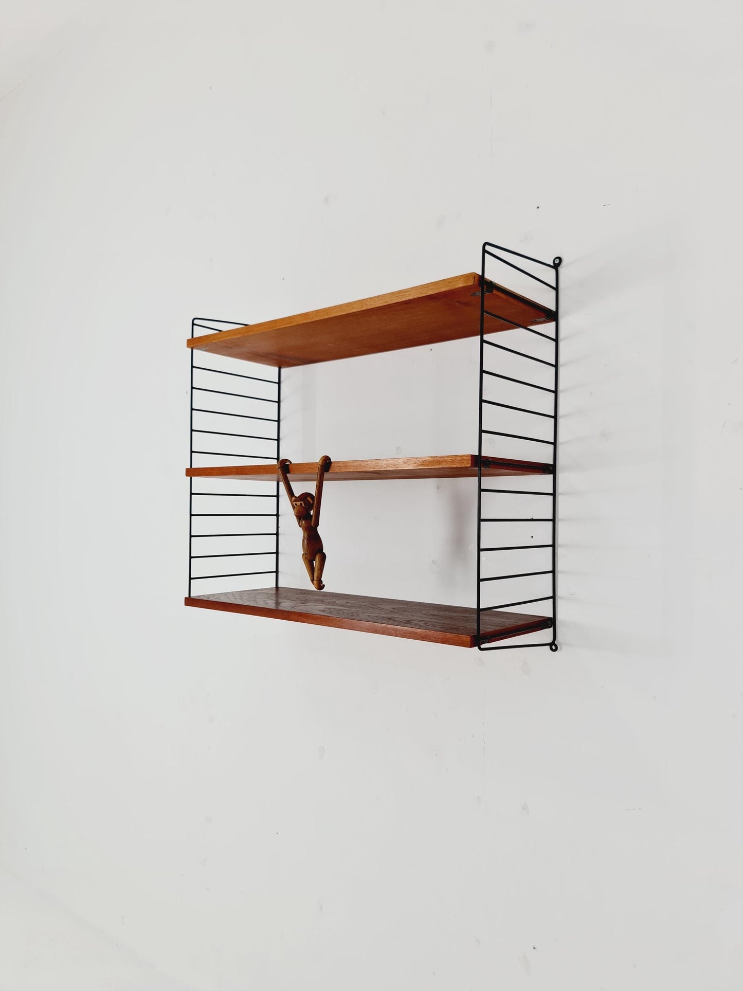 Original MCM Teak shelving system - consists of black lacquered metal ladders, from string Stockholm 1960s