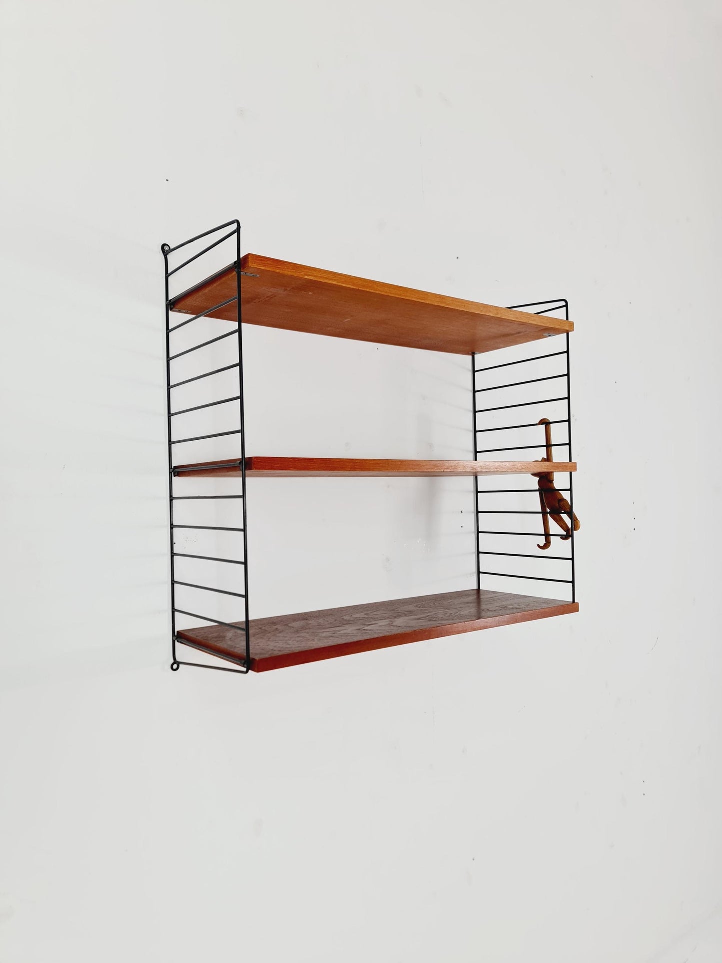 Original MCM Teak shelving system - consists of black lacquered metal ladders, from string Stockholm 1960s