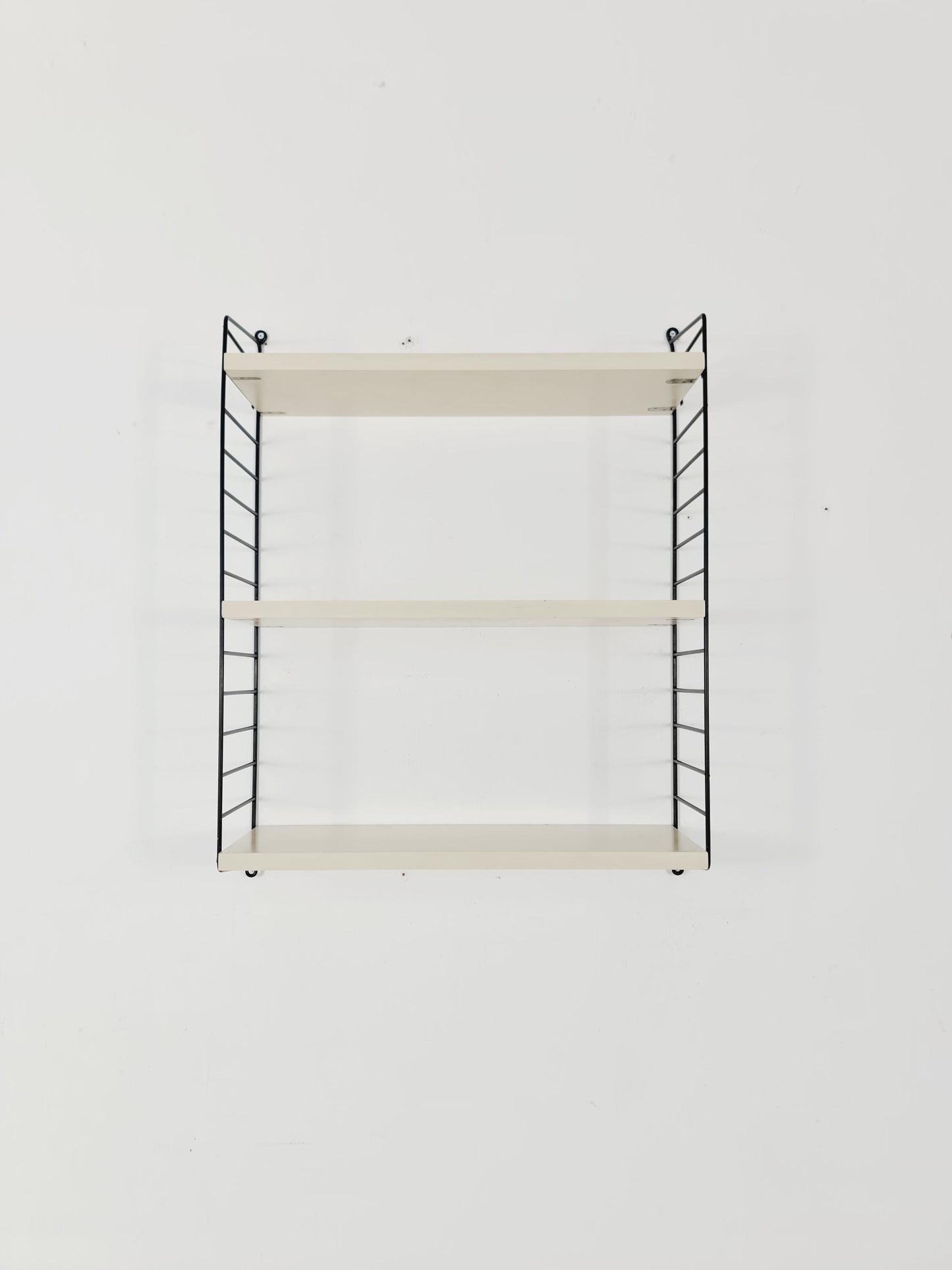 Original MCM wood shelving system - consists of black lacquered metal ladders, from string Stockholm 1960s