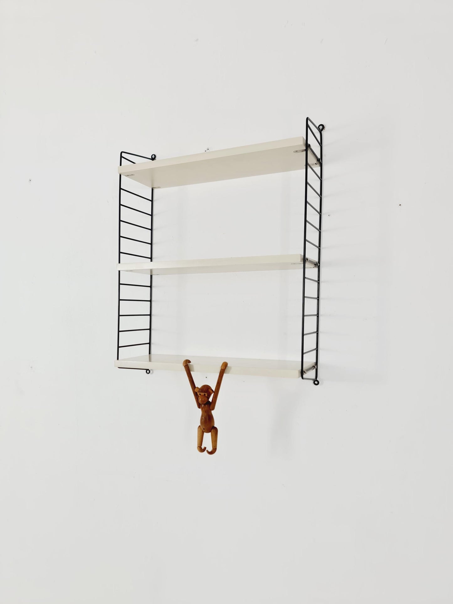 Original MCM wood shelving system - consists of black lacquered metal ladders, from string Stockholm 1960s