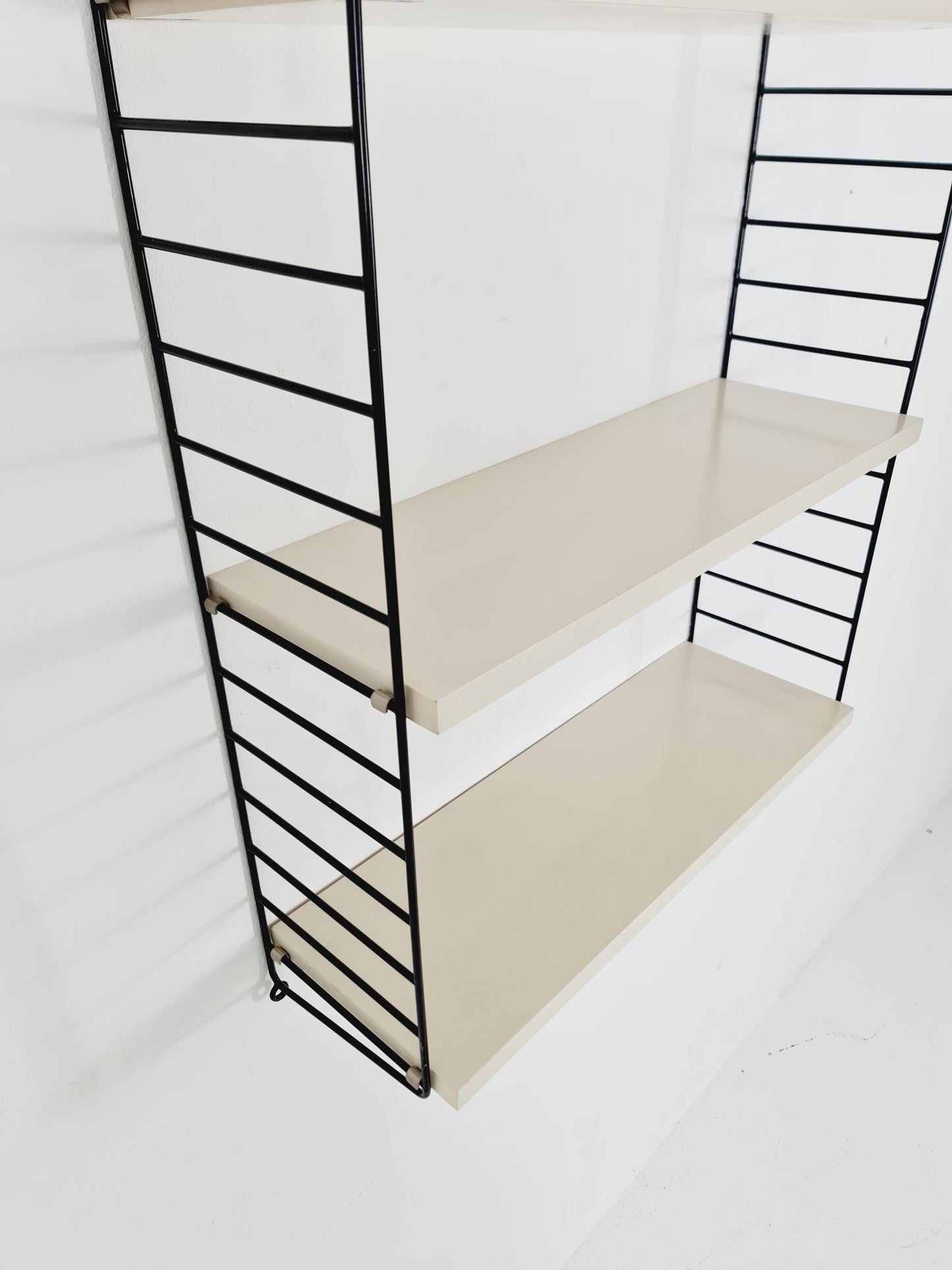 Original MCM wood shelving system - consists of black lacquered metal ladders, from string Stockholm 1960s