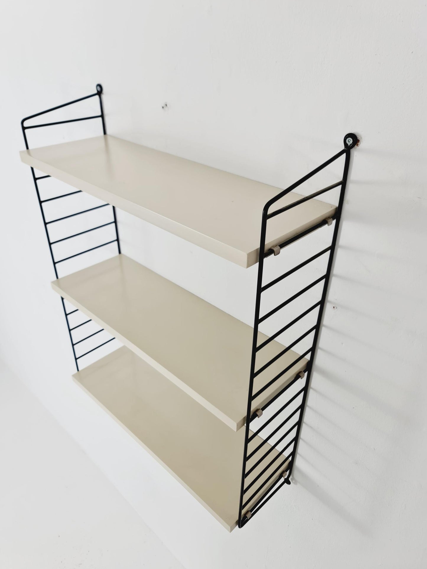 Original MCM wood shelving system - consists of black lacquered metal ladders, from string Stockholm 1960s
