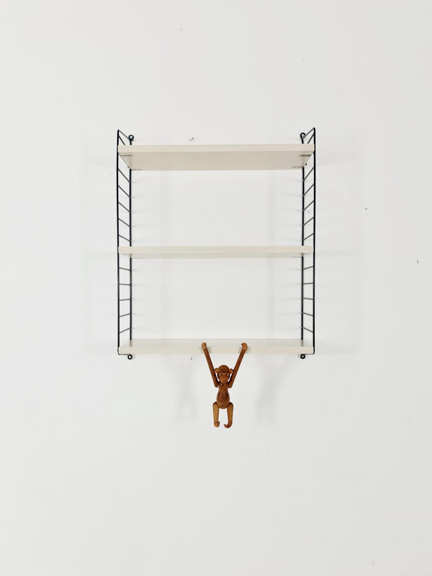 Original MCM wood shelving system - consists of black lacquered metal ladders, from string Stockholm 1960s
