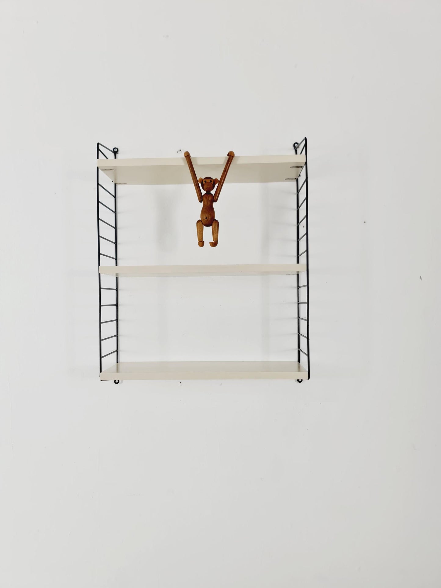 Original MCM wood shelving system - consists of black lacquered metal ladders, from string Stockholm 1960s