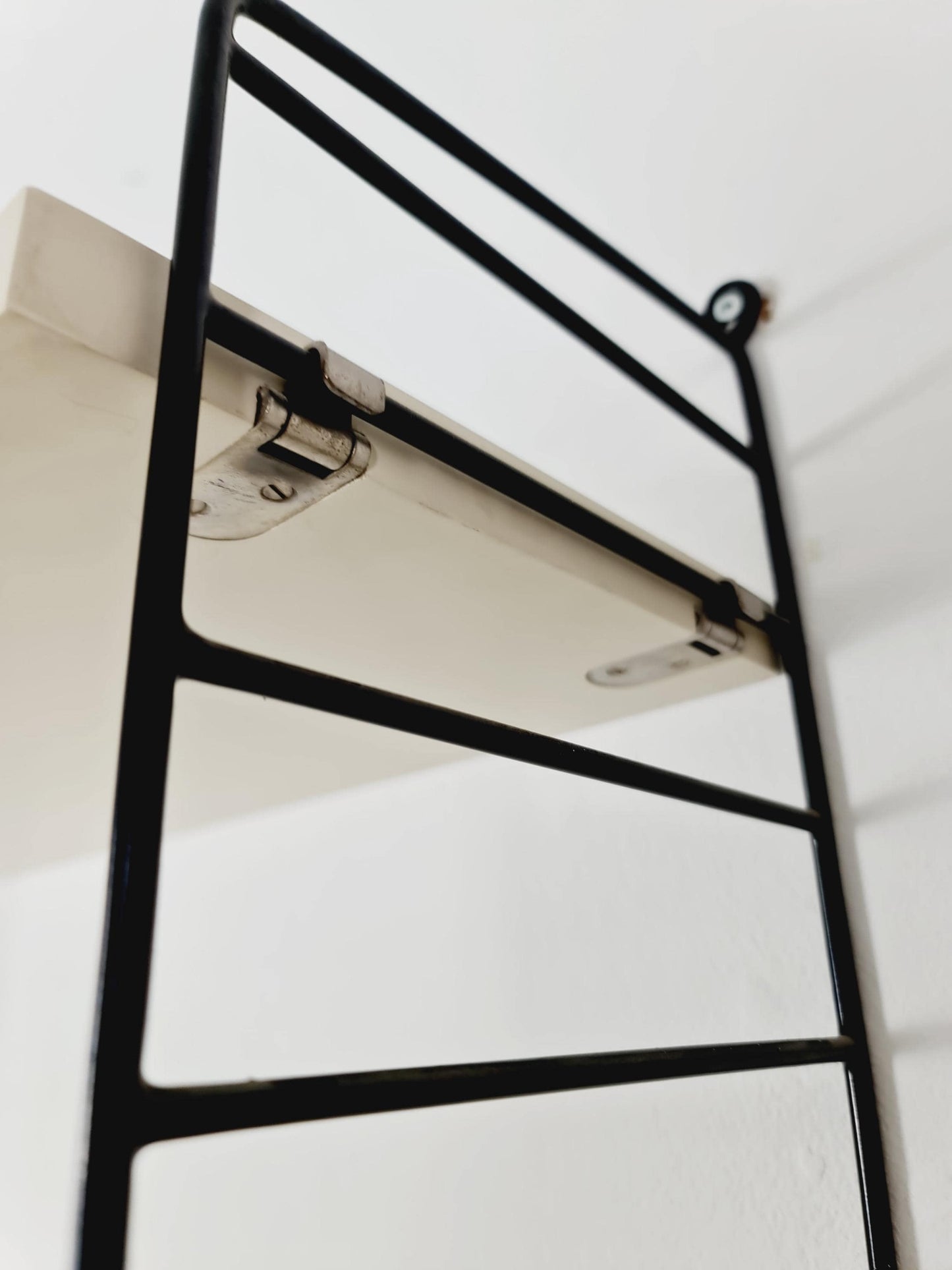 Original MCM wood shelving system - consists of black lacquered metal ladders, from string Stockholm 1960s