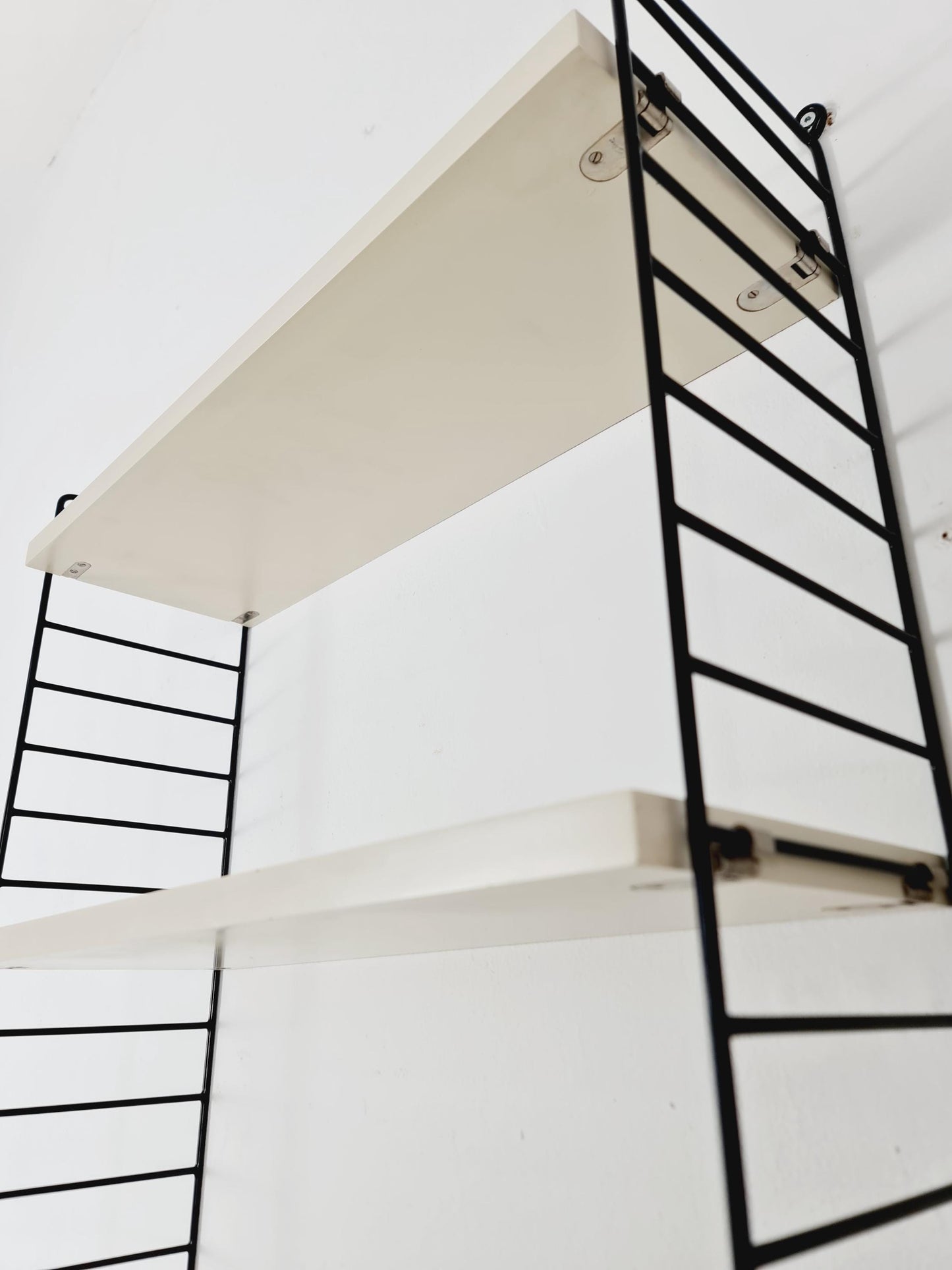 Original MCM wood shelving system - consists of black lacquered metal ladders, from string Stockholm 1960s