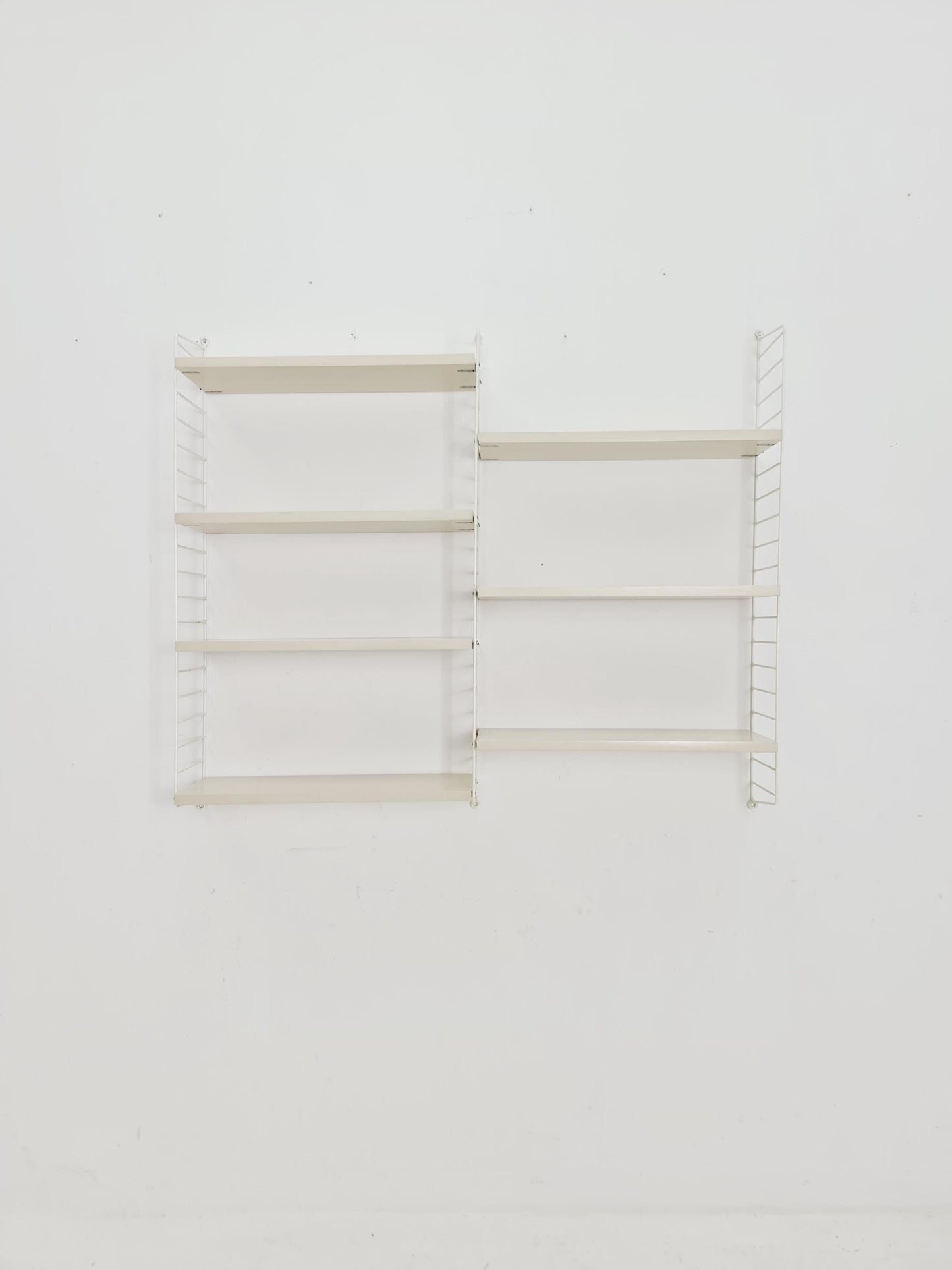 Original MCM wood shelving system - consists of black lacquered metal ladders, from string Stockholm 1960s