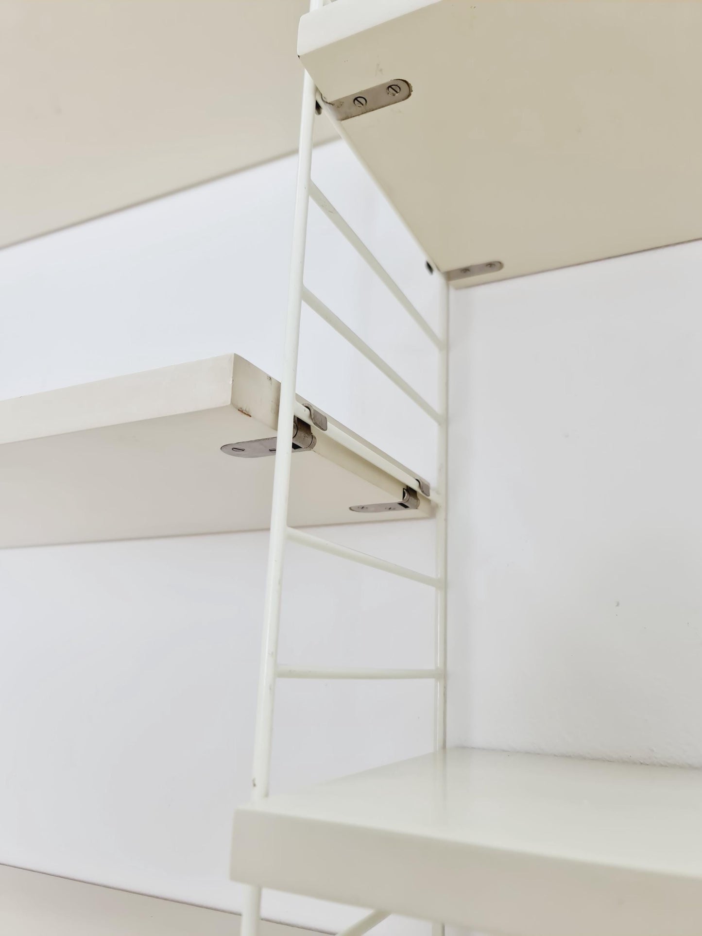Original MCM wood shelving system - consists of black lacquered metal ladders, from string Stockholm 1960s