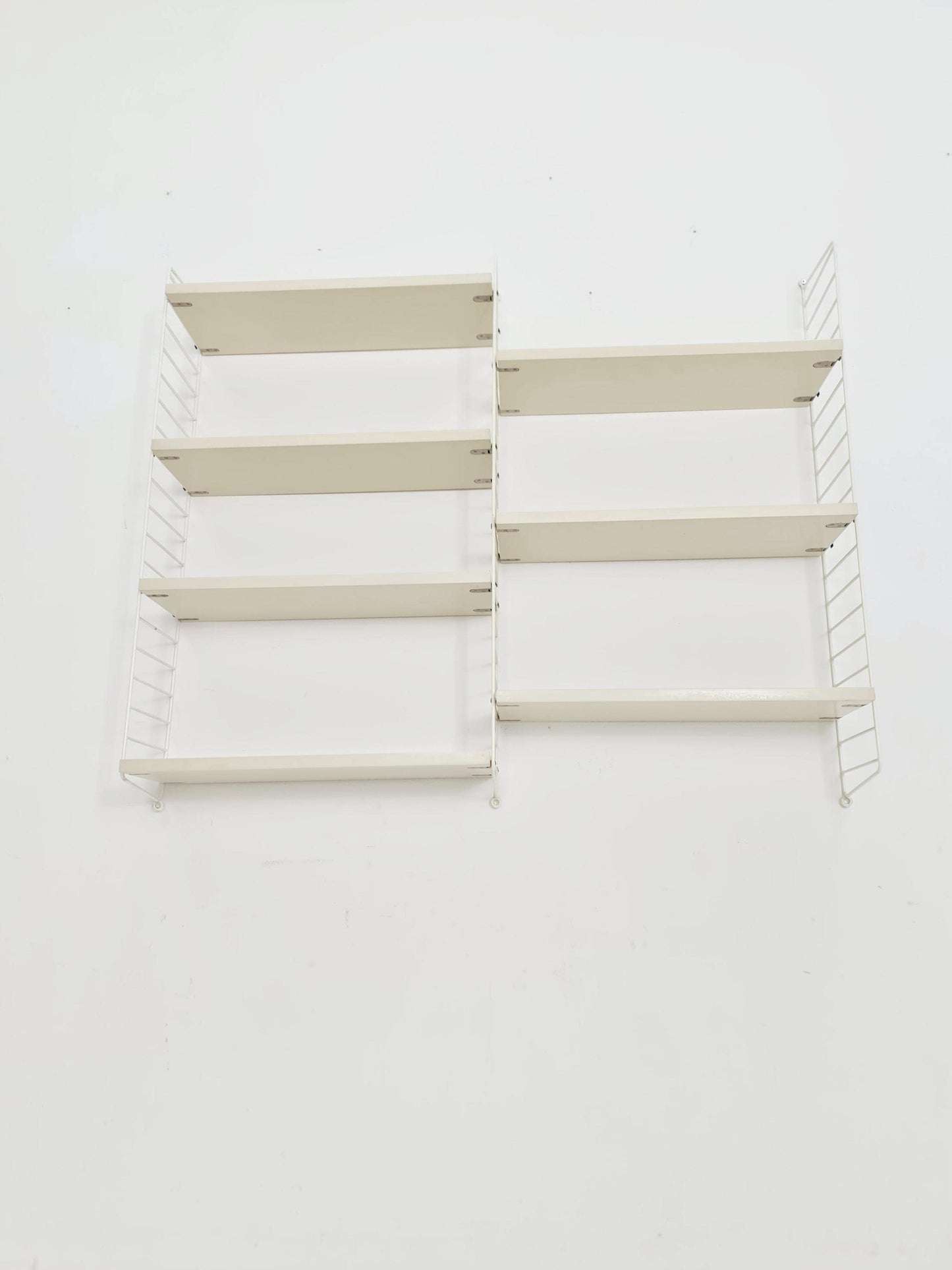 Original MCM wood shelving system - consists of black lacquered metal ladders, from string Stockholm 1960s