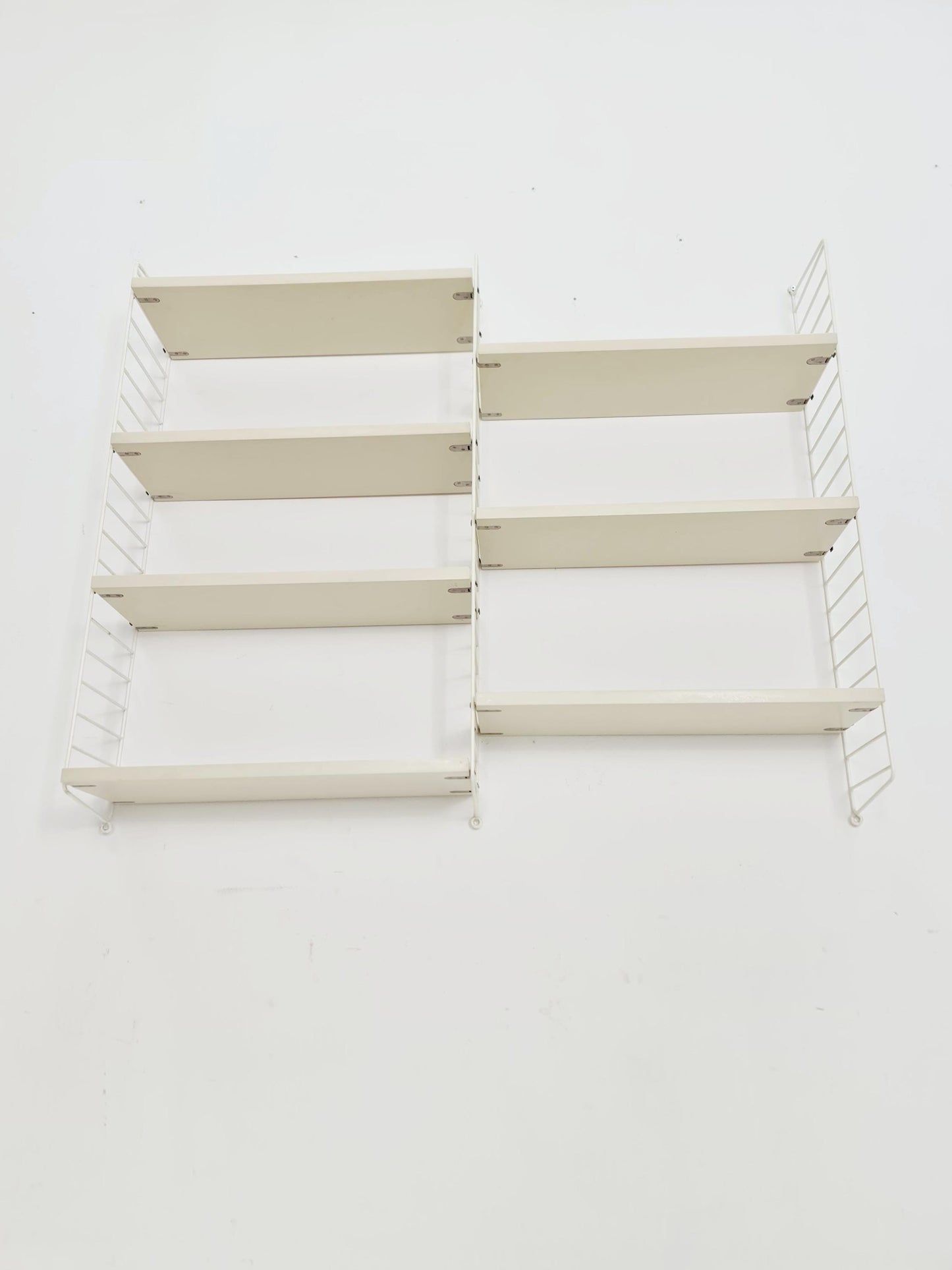 Original MCM wood shelving system - consists of black lacquered metal ladders, from string Stockholm 1960s