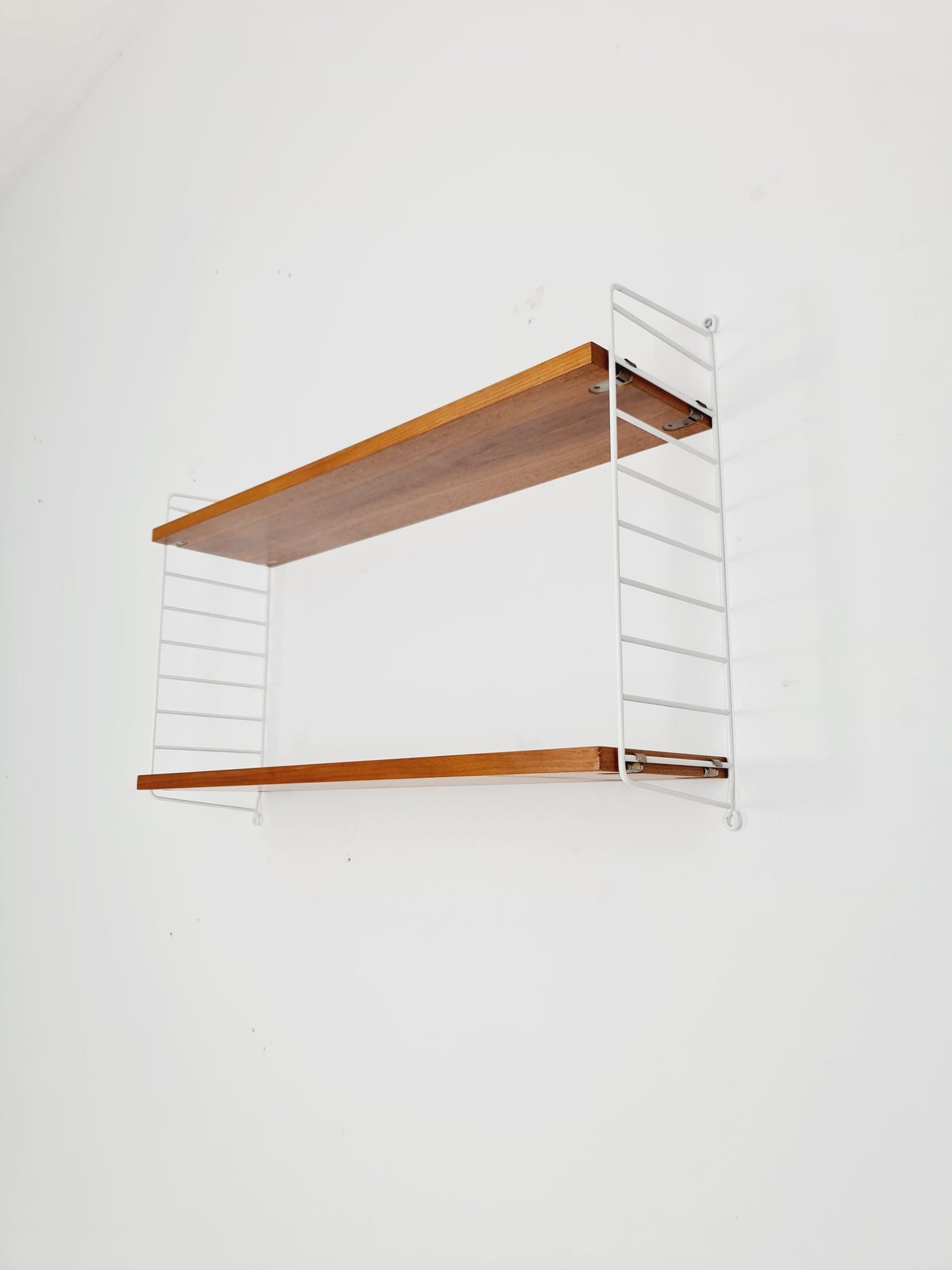 Original MCM Teak shelving system - consists of White lacquered metal ladders, from string Stockholm 1960s