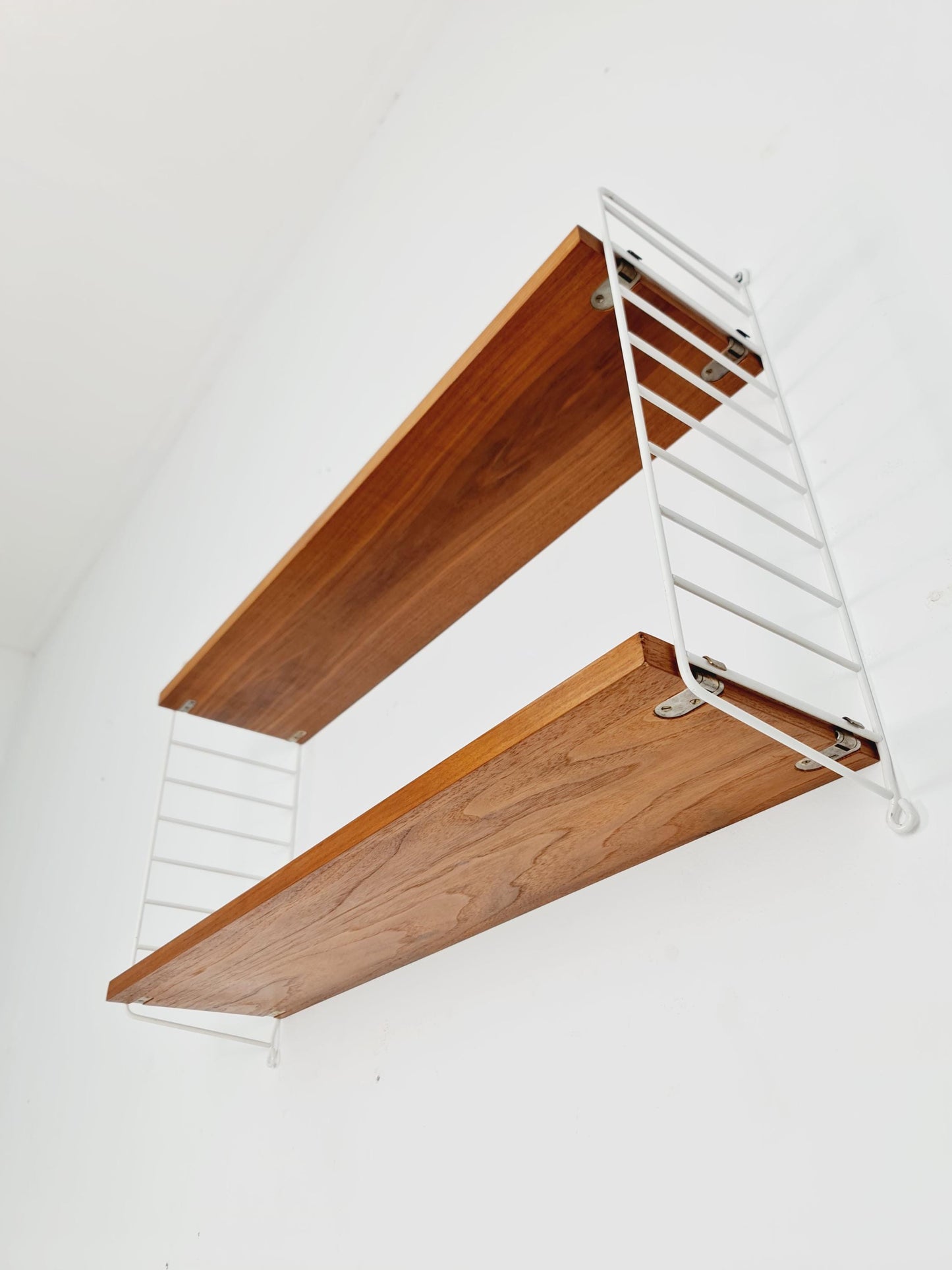 Original MCM Teak shelving system - consists of White lacquered metal ladders, from string Stockholm 1960s